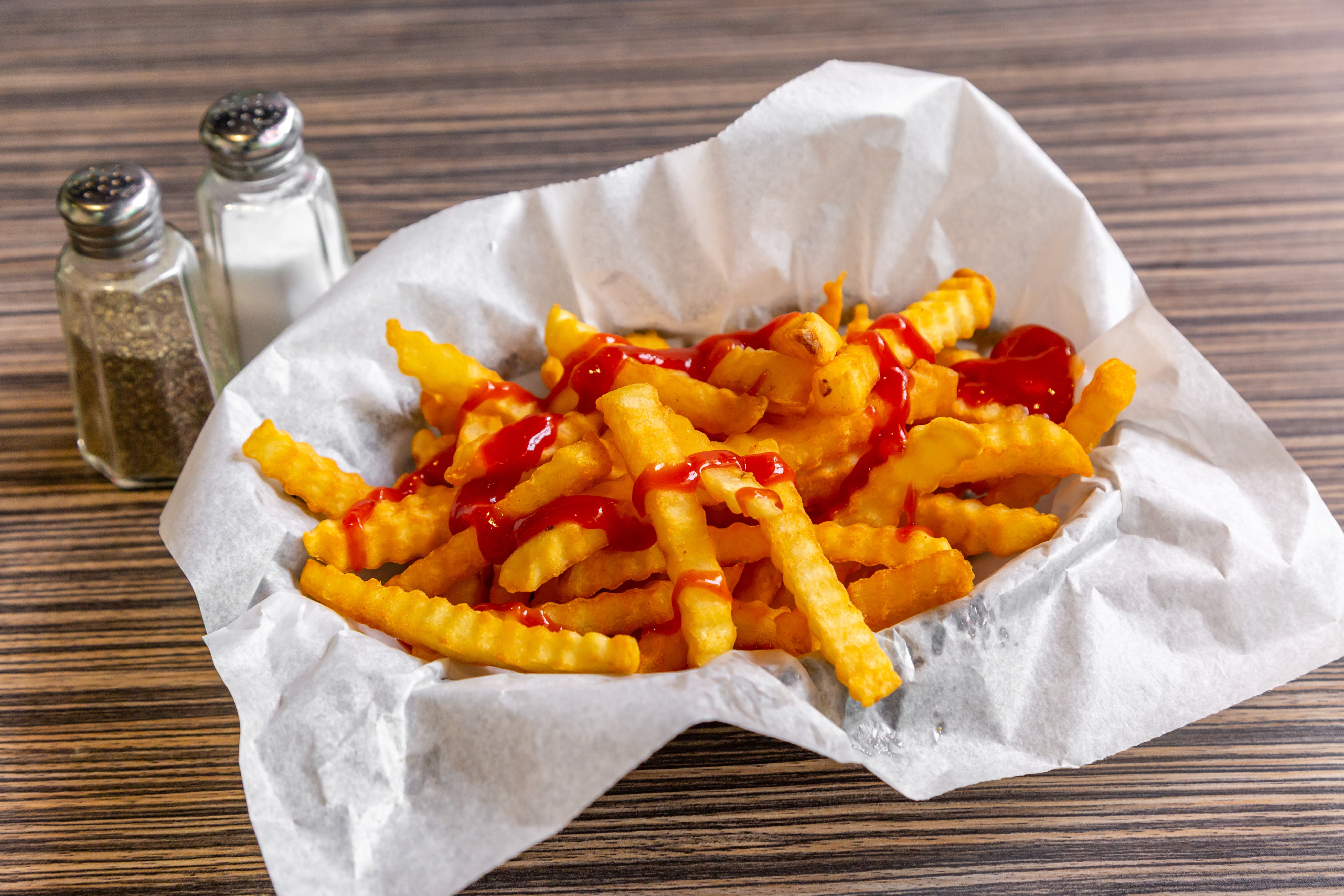 Order French Fries - Appetizer food online from Art of Pizza on State Street store, Chicago on bringmethat.com