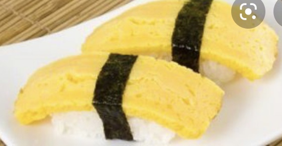 Order 59. Tamago Nigiri 玉子蛋贴面 food online from Tengu Sushi store, Newport on bringmethat.com