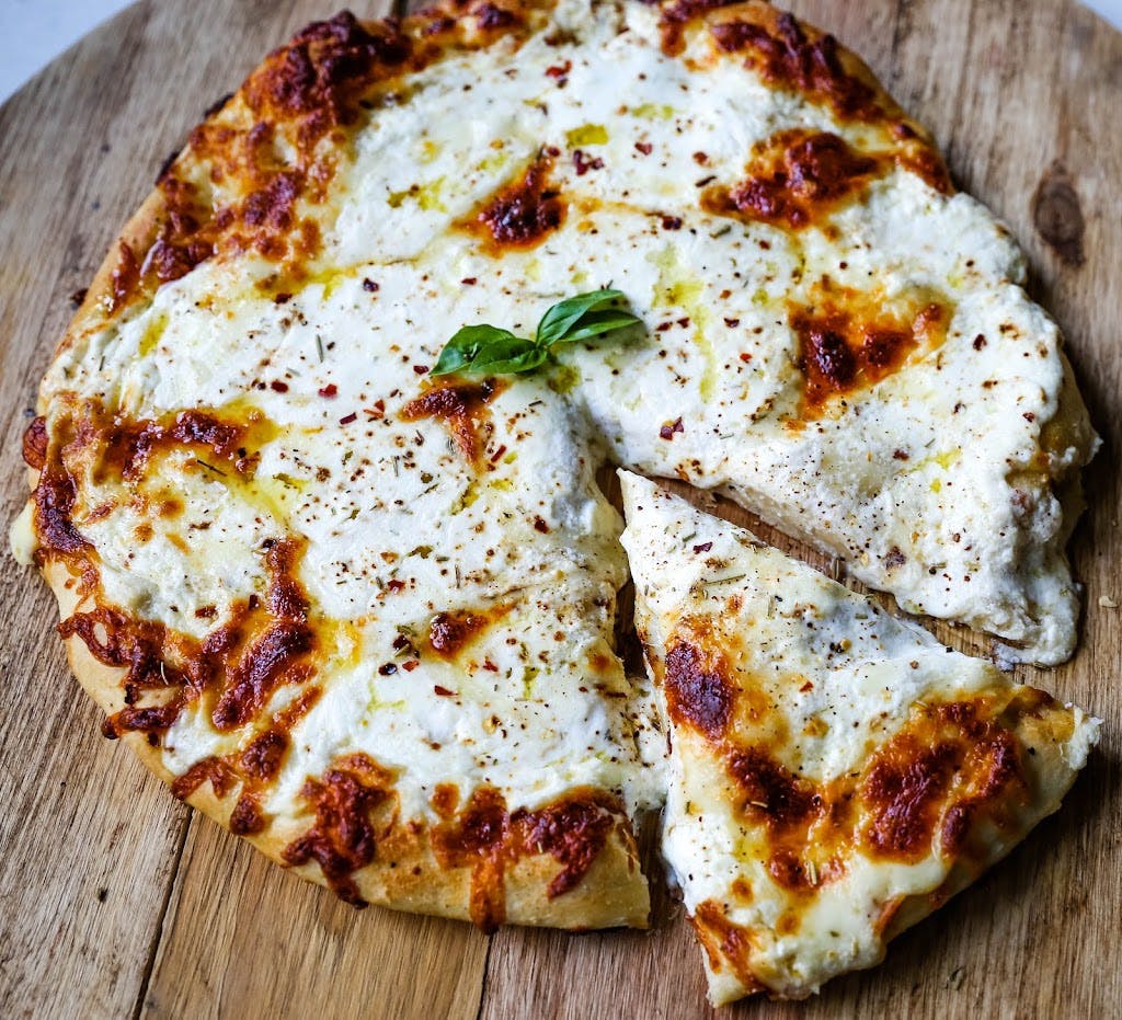 Order White Specialty Pizza - Personal food online from Nino Italian Restaurant store, Reading on bringmethat.com