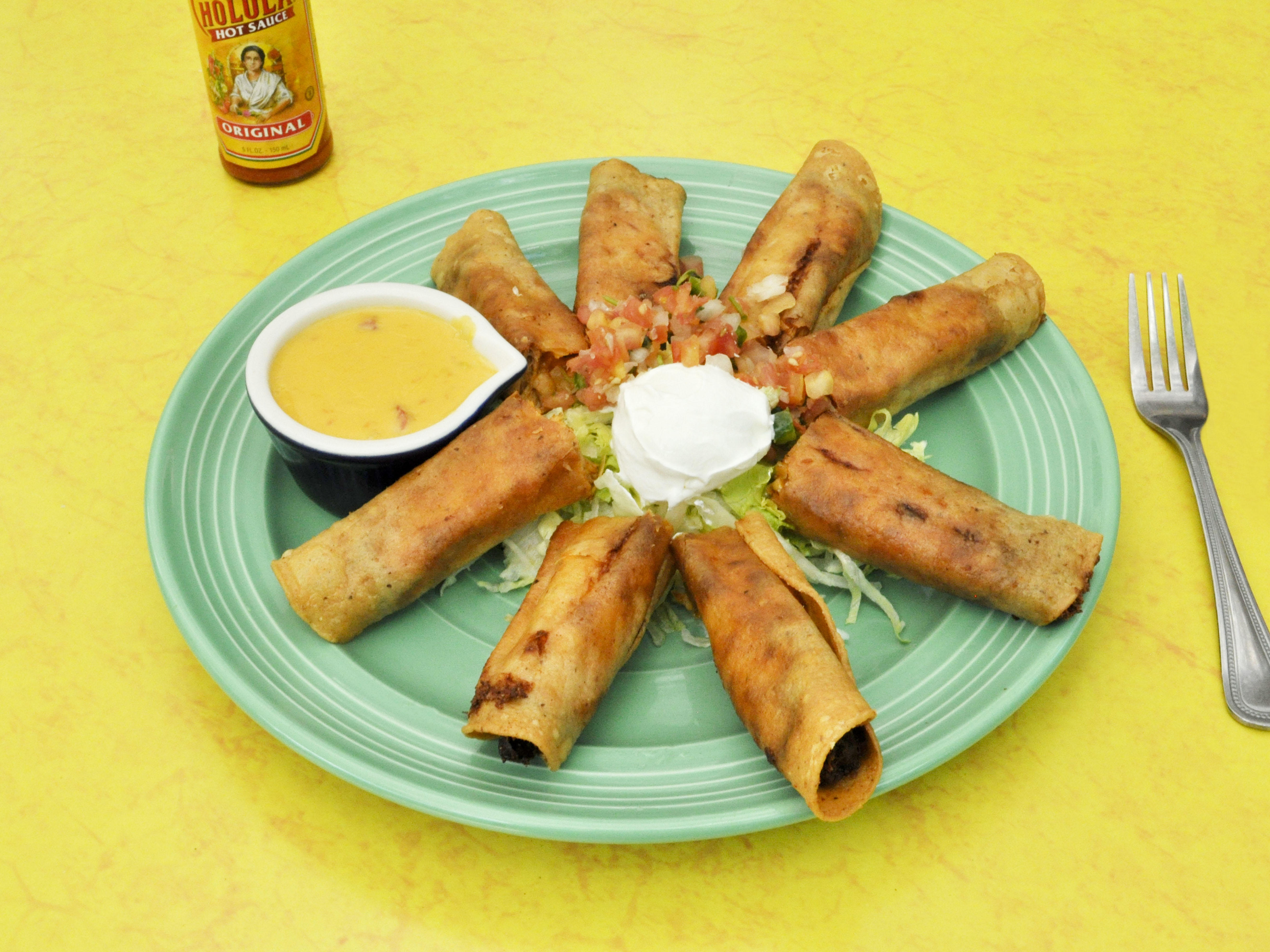 Order Taquitos food online from Vaqueros Cafe & Cantina store, Austin on bringmethat.com
