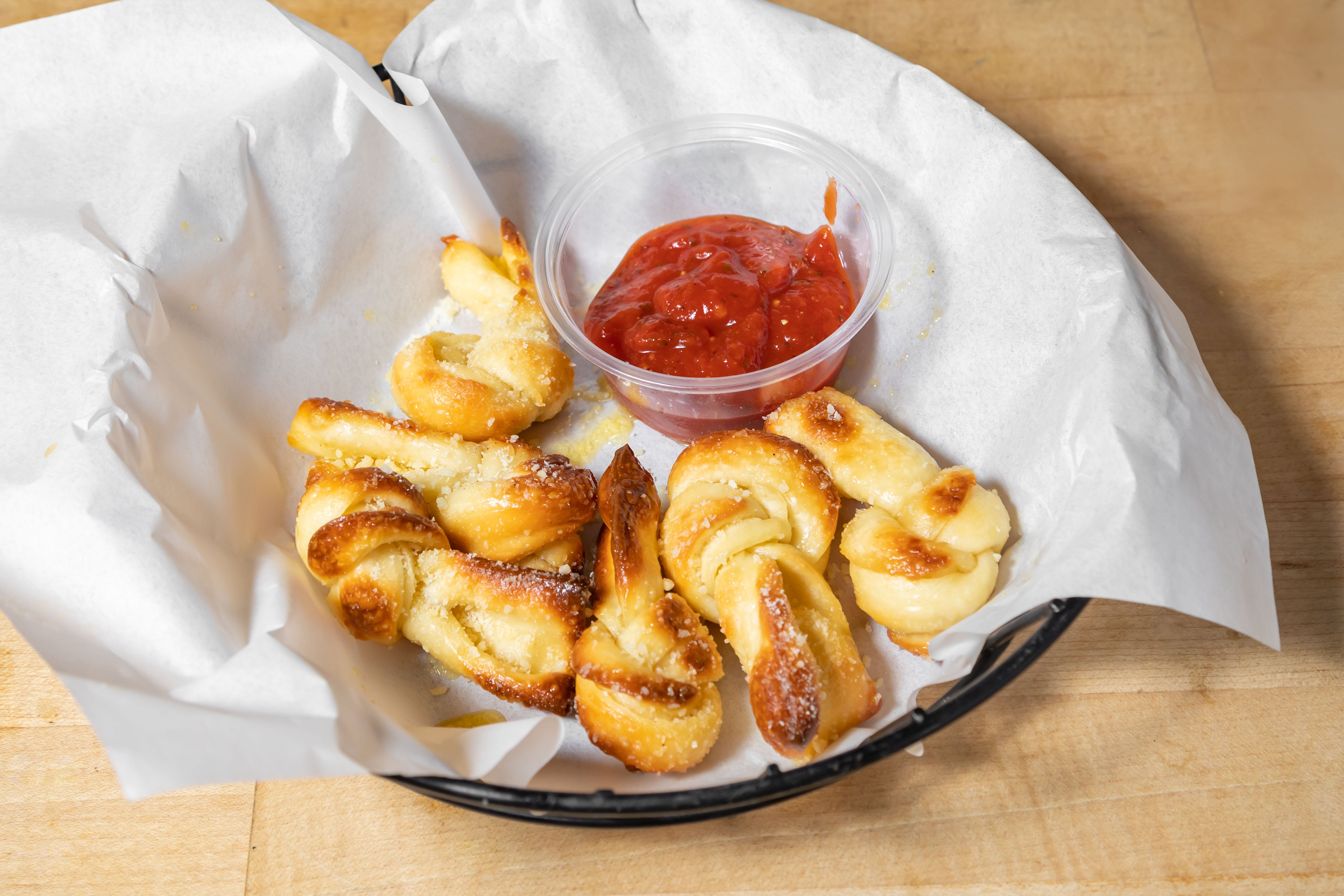 Order Garlic Knots - 6 Pieces food online from Firehouse Pizzeria store, San Francisco on bringmethat.com