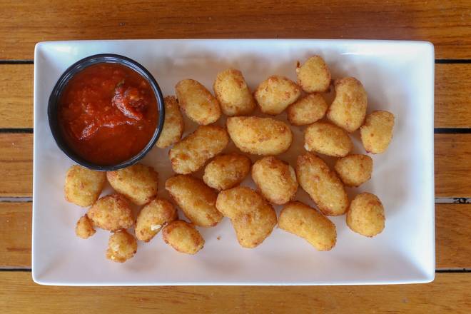 Order Breaded Wisconsin Cheese Curds  food online from Tommy Tavern + Tap store, Princeton on bringmethat.com