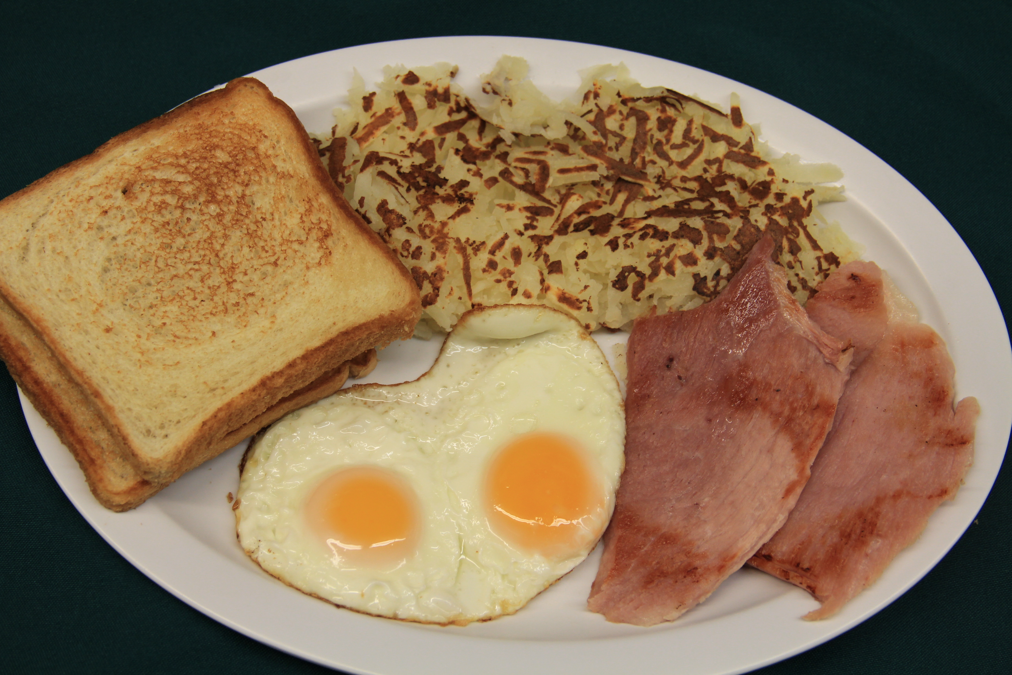 Order 2 Eggs, Hash Browns and Ham food online from Clark El Ranchito store, Chicago on bringmethat.com
