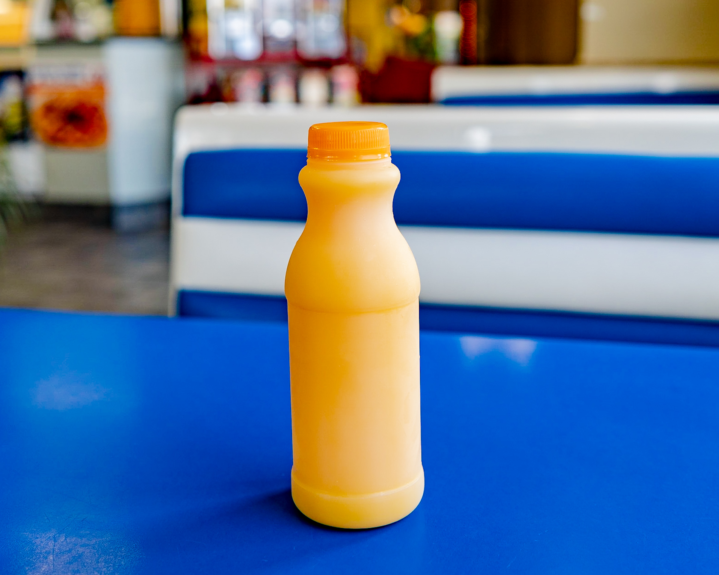 Order Orange Juice Bottle food online from Manuel Burger store, Los Angeles on bringmethat.com