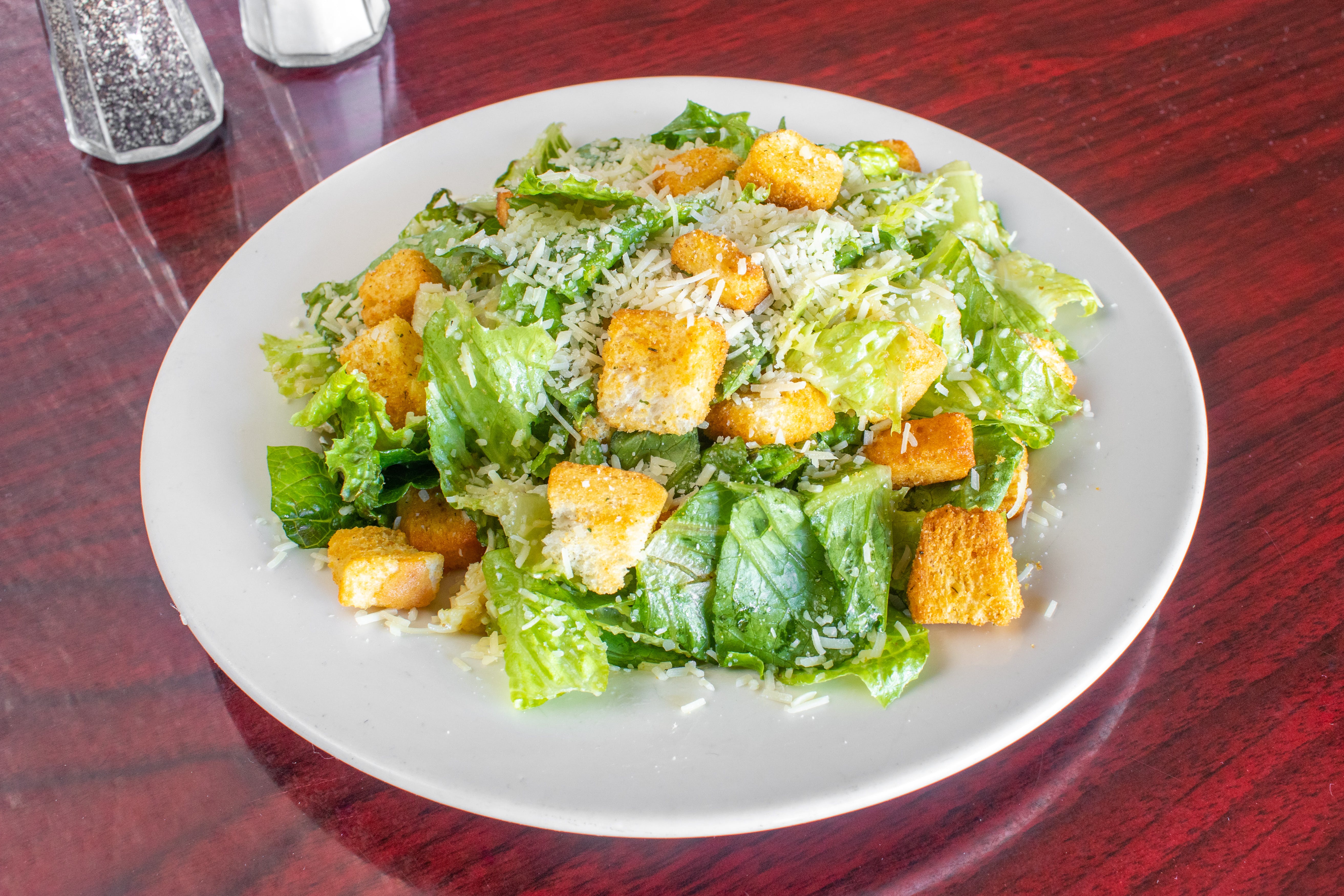 Order Caesar Salad - Salad food online from Bambino's Restaurant store, Concord on bringmethat.com