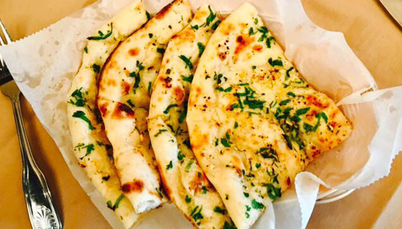 Order Garlic & Cheese Naan food online from Momo King store, Mountain View on bringmethat.com