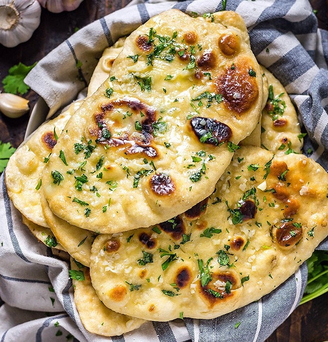 Order Garlic Naan food online from India Oven store, Roseville on bringmethat.com
