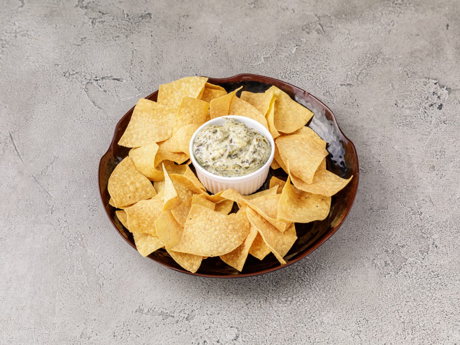 Order Chips and a Cup of Spinach and Artichoke Dip food online from Olde Town Tavern & Grille store, Kennesaw on bringmethat.com