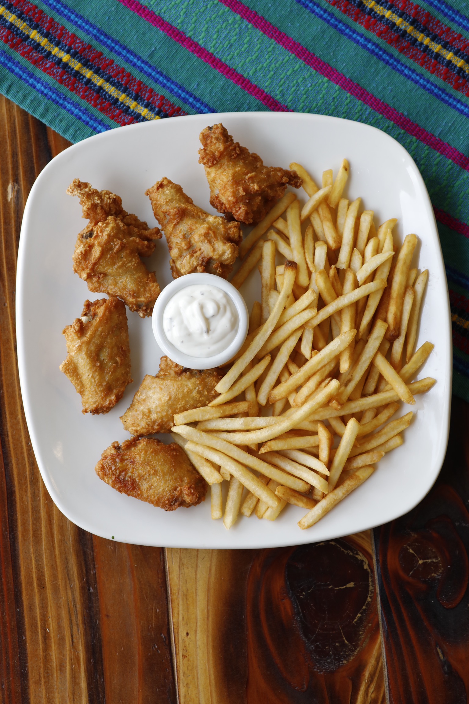Order 6 chicken wings and French fries  food online from Cafe Guatemalteco store, San Francisco on bringmethat.com