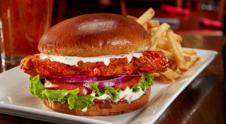 Order Spicy Mother Clucker Sandwich food online from Tilted Kilt store, Prince George on bringmethat.com