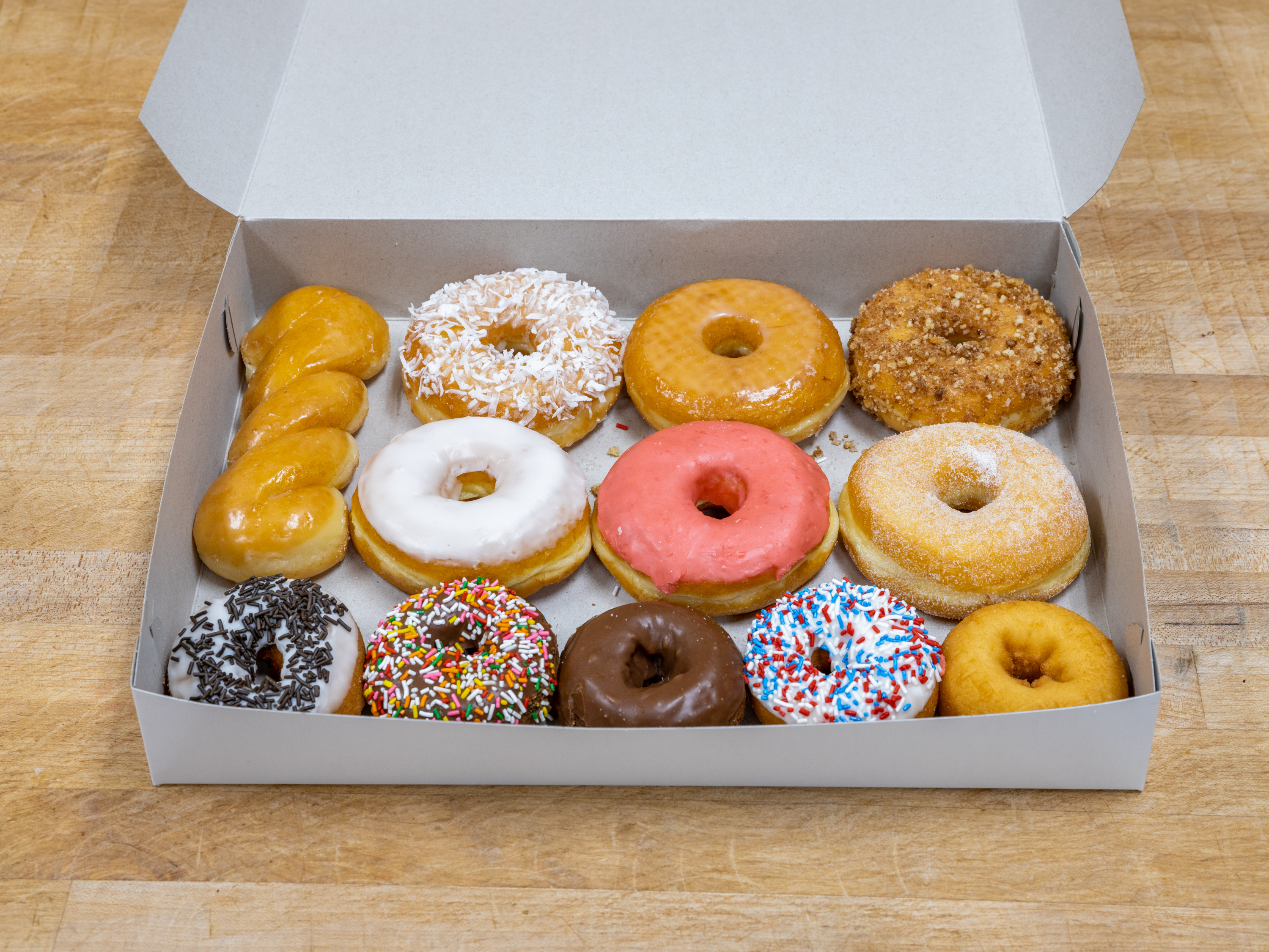 Order 1 Dozen House Mixed food online from K-Inn Donuts store, Paramount on bringmethat.com