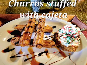 Order churros stuffed with cajeta food online from Cantina Ixtaccíhuatl store, Portsmouth on bringmethat.com