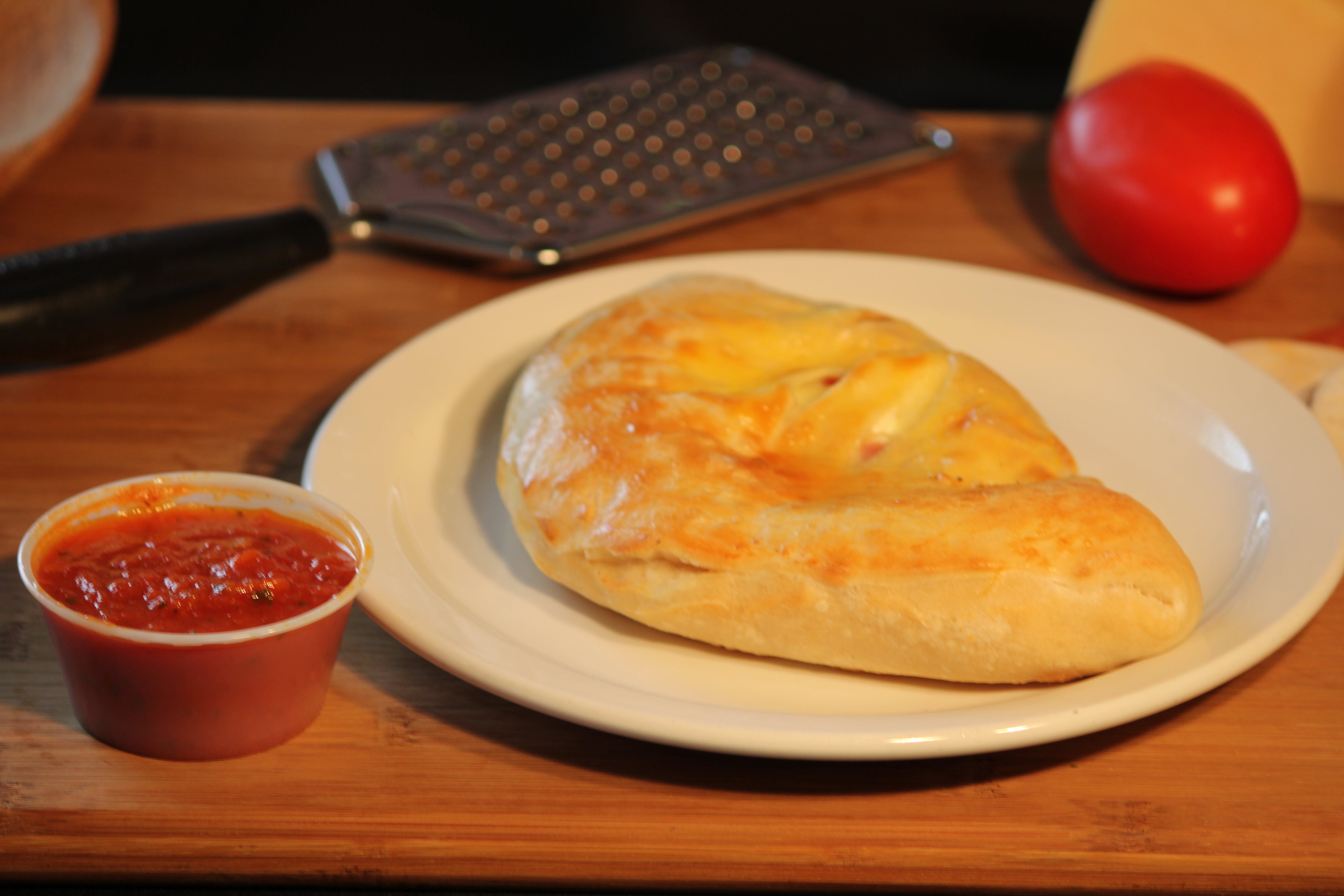 Order Ham & Cheese Calzone - Calzone food online from Luca Pizza di Roma store, Lafayette on bringmethat.com