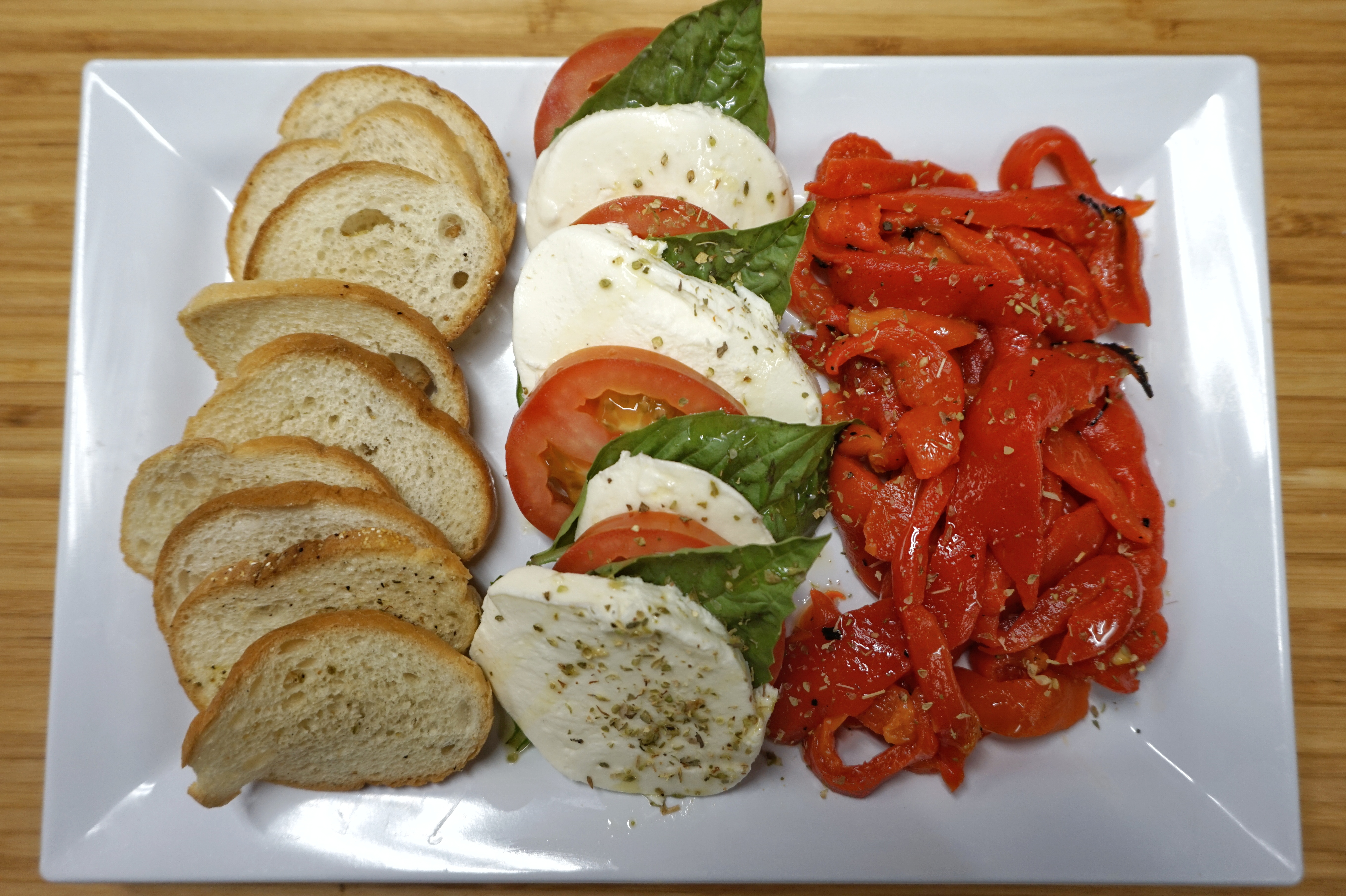Order Fresh Mozzarella, Tomato and Basil Plate food online from Iguana Cafe store, Chicago on bringmethat.com