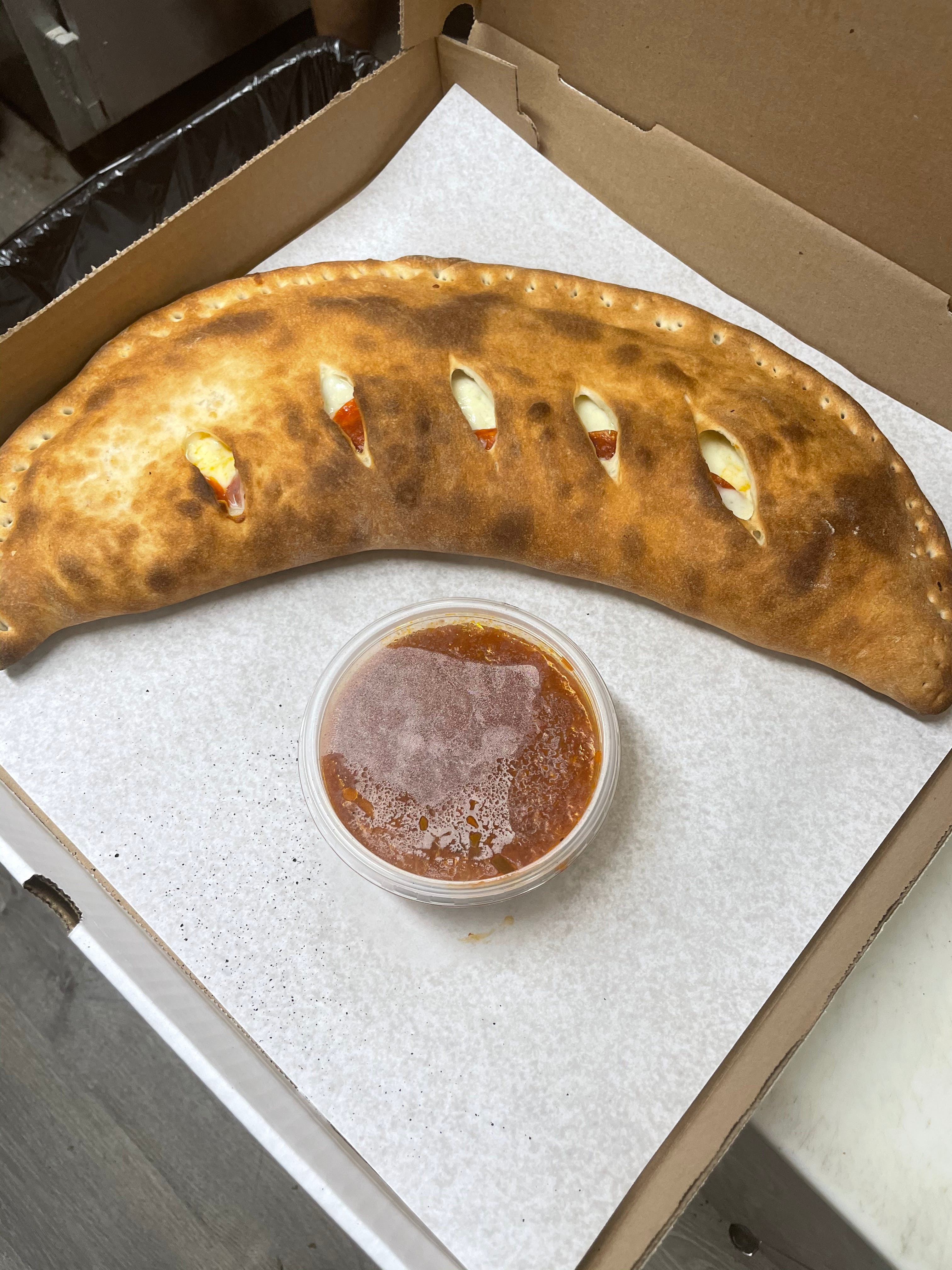 Order Famous Classic - 12'' Calzone food online from Amici Vicinato store, Lafayette Hill on bringmethat.com