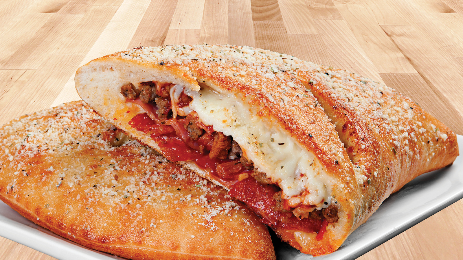 Order All-Meat Combo Calzone food online from Godfathers Pizza store, Cedar Rapids on bringmethat.com