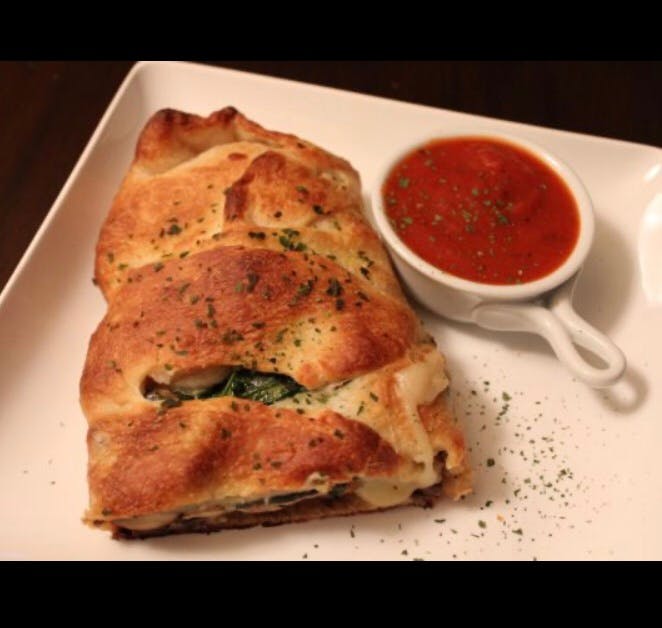 Order Calzone - Regular food online from Hometown Pizza Cafe store, Water Valley on bringmethat.com