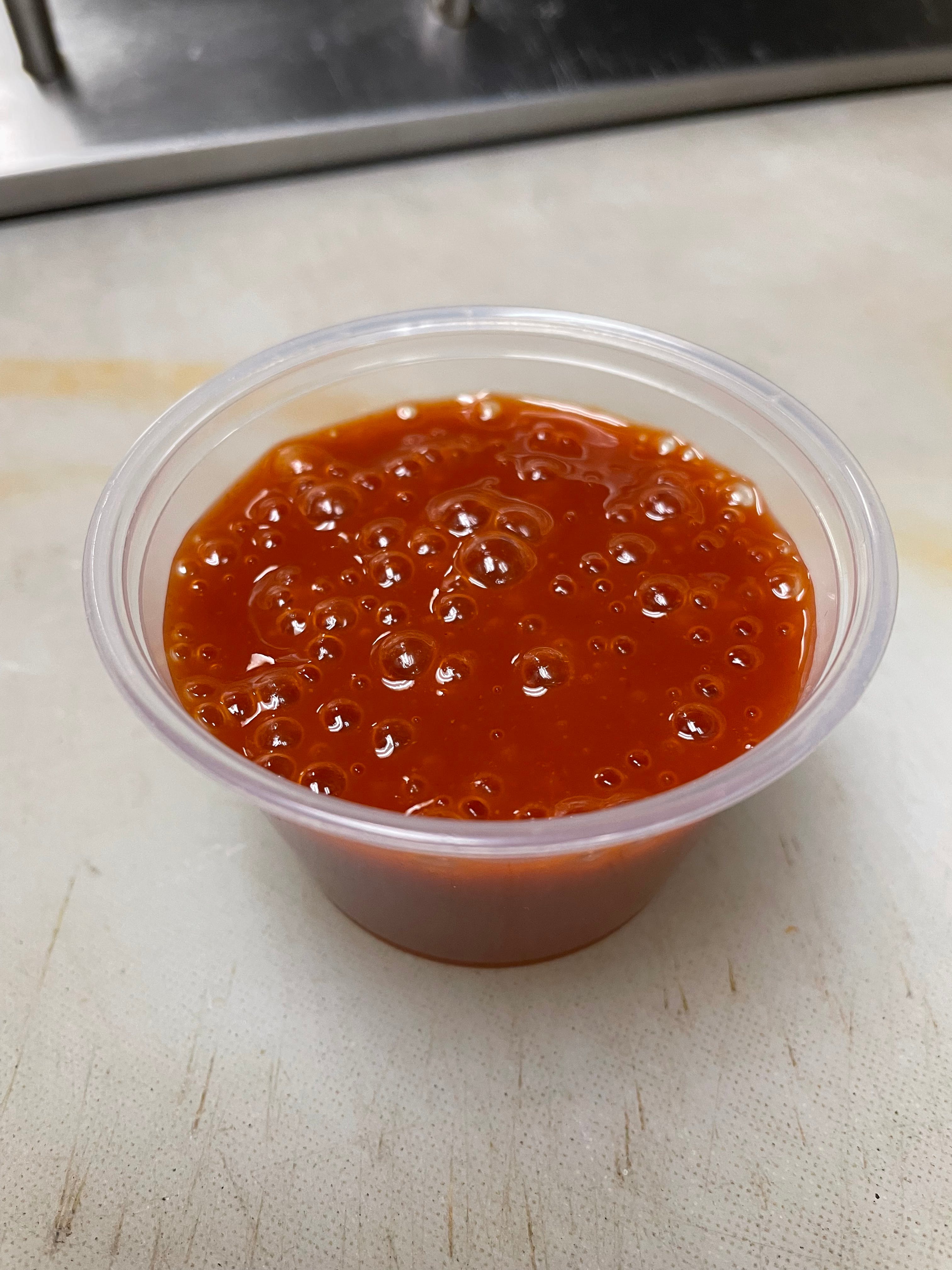 Order Hot Sauce - 2 oz. food online from Brooklyn Pizza & Pasta store, Cincinnati on bringmethat.com
