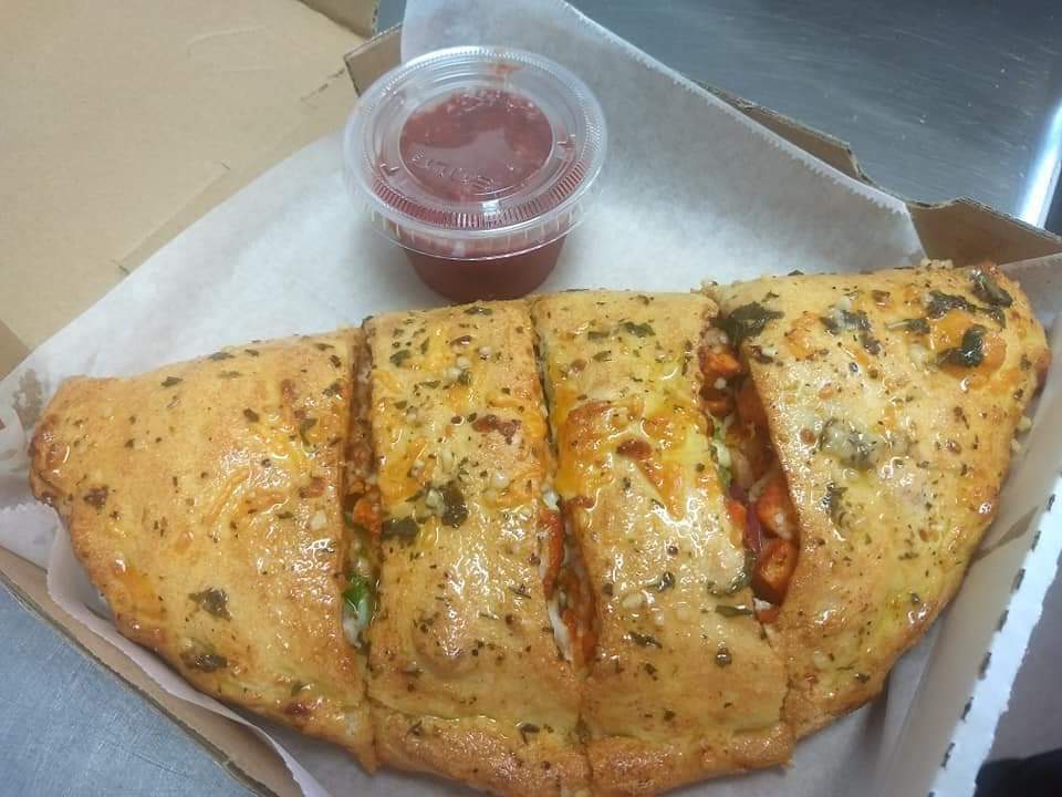 Order Bacon and Pepperoni Calzone food online from Promise Pizza store, Round Rock on bringmethat.com