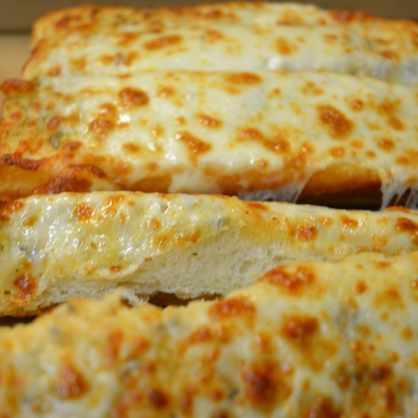 Order Small Garlic Bread with Cheese food online from Primo Pizza store, Daly City on bringmethat.com