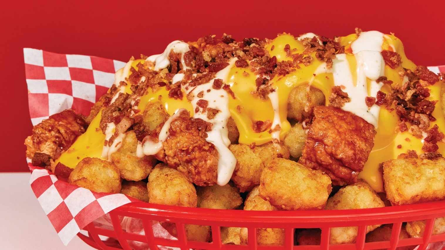 Order Cheesy Chicken Loaded Nachos: Tots food online from Wings Over store, Pittsburgh on bringmethat.com