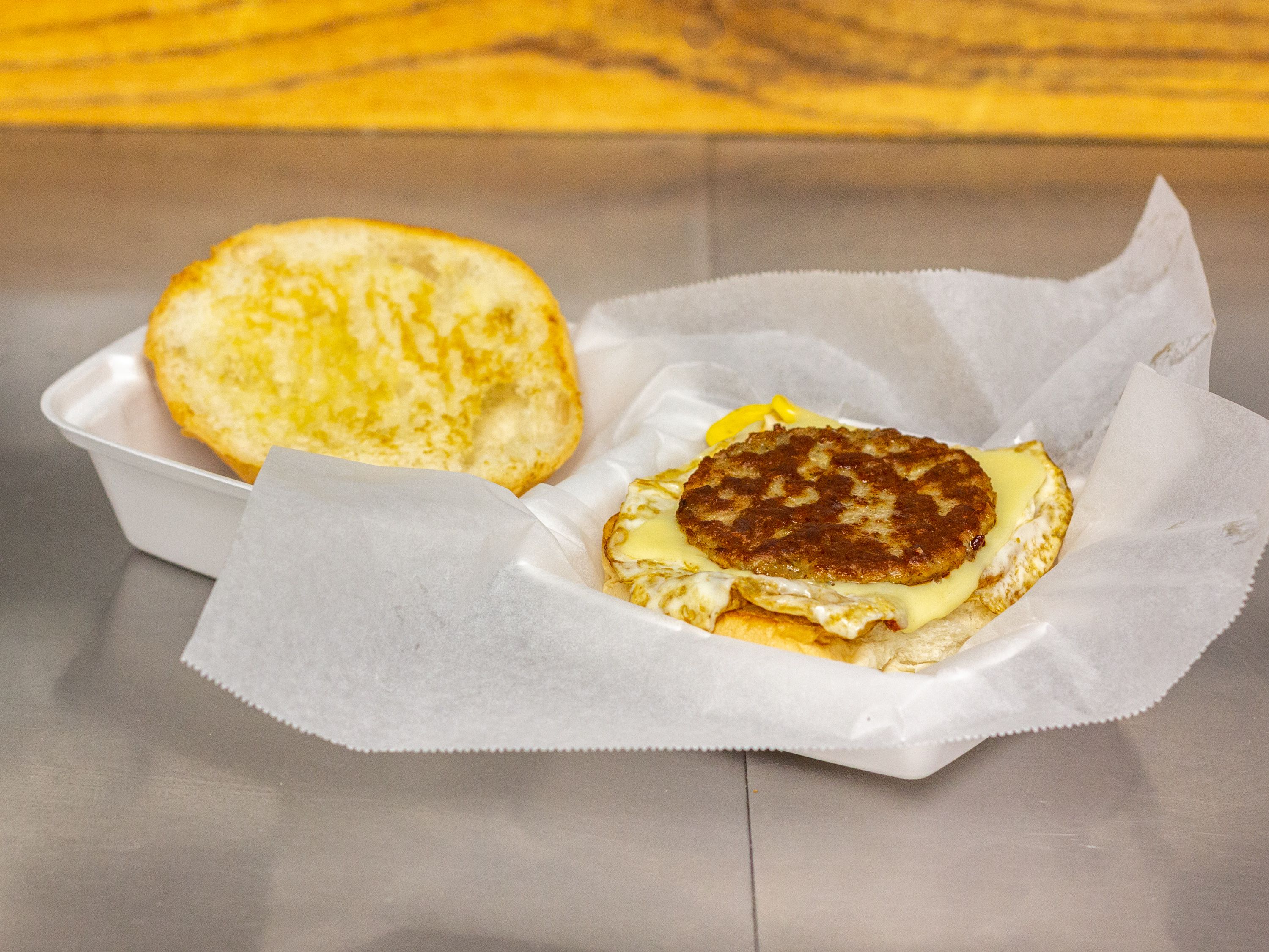 Order Sausage Egg and cheese breakfast sandwich  food online from Wavy Baby Subs store, Millbury on bringmethat.com