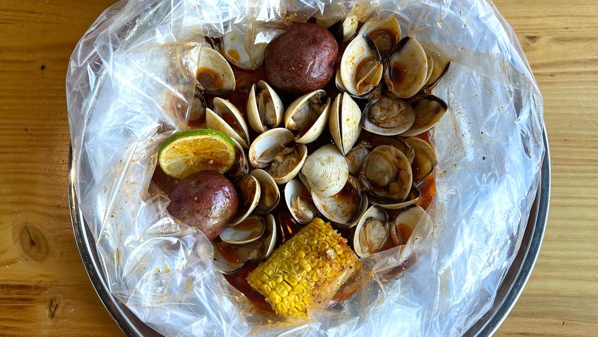 Order 1 Lb Clams food online from The Juicy Seafood store, Sandy Springs on bringmethat.com