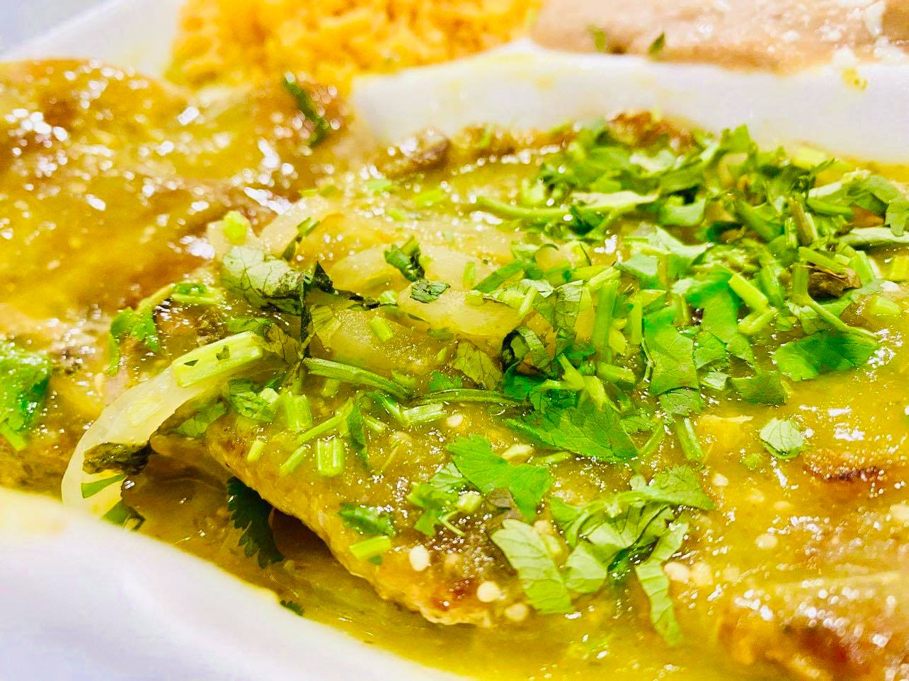 Order Chuletas de Puerco en Salsa Verde food online from Antojitos De Dona Maria store, Summit on bringmethat.com
