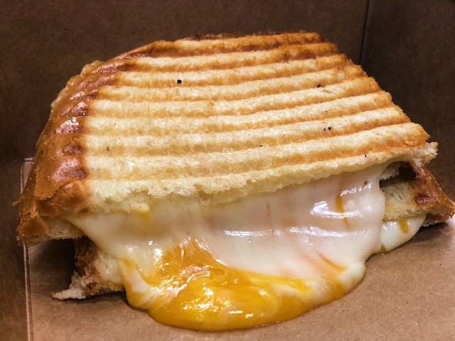 Order Cheddar - Havarti Panini - served hot food online from Our Happy Place Cafe store, Corona on bringmethat.com