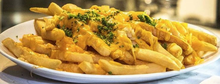Order Garlic & Cheddar Fries food online from Cafe 50 store, Los Angeles on bringmethat.com