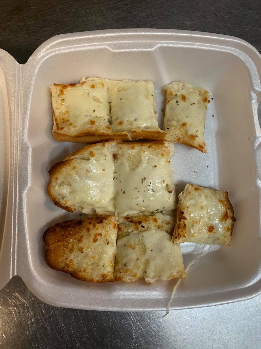 Order Garlic Bread with Cheese - Appetizer food online from Mia's Italian Bistro store, Wichita Falls on bringmethat.com