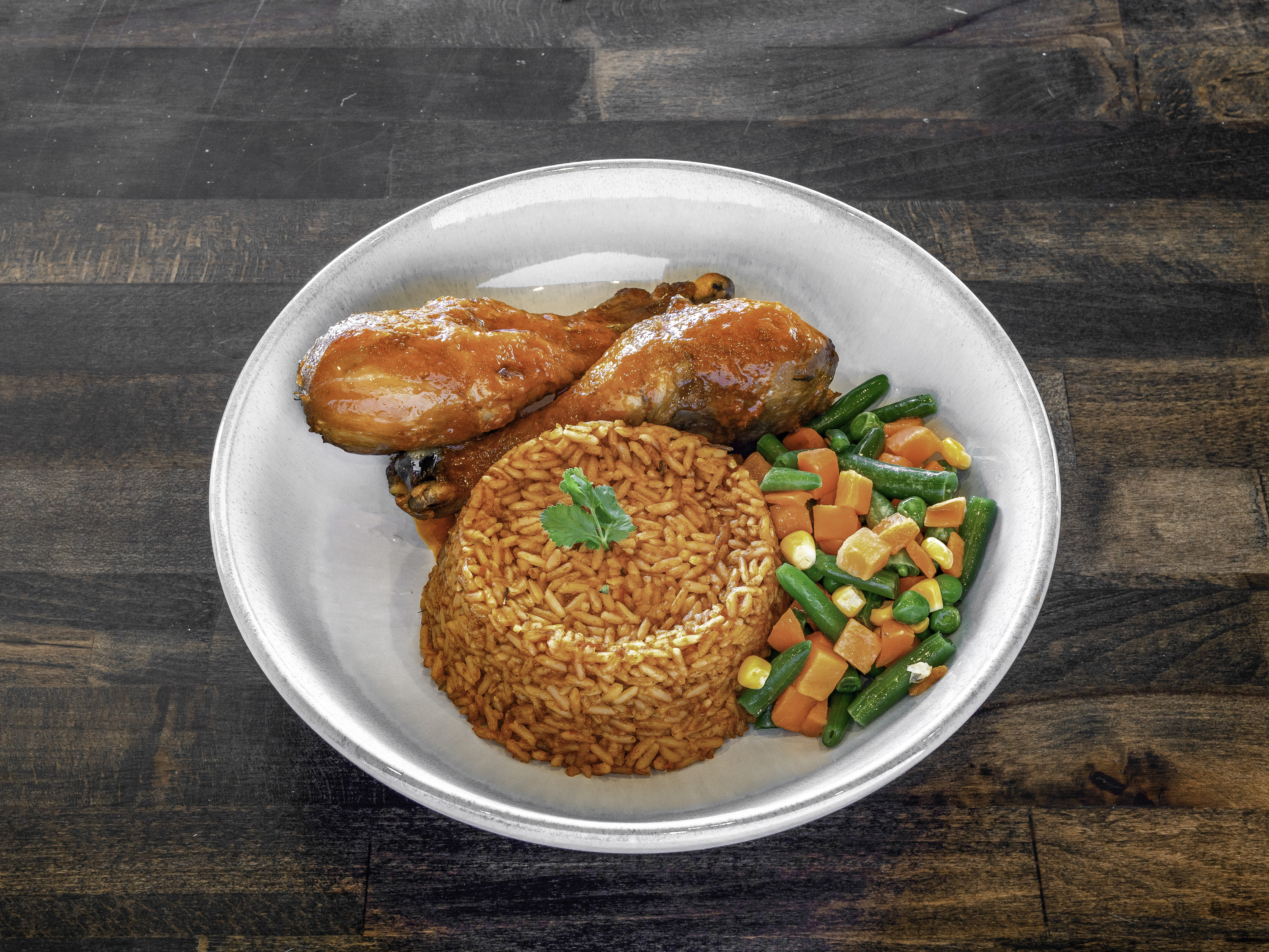 Order Jollof Rice w/ Veggie Mix food online from Chobas African Kitchen & Bakery store, Waldorf on bringmethat.com