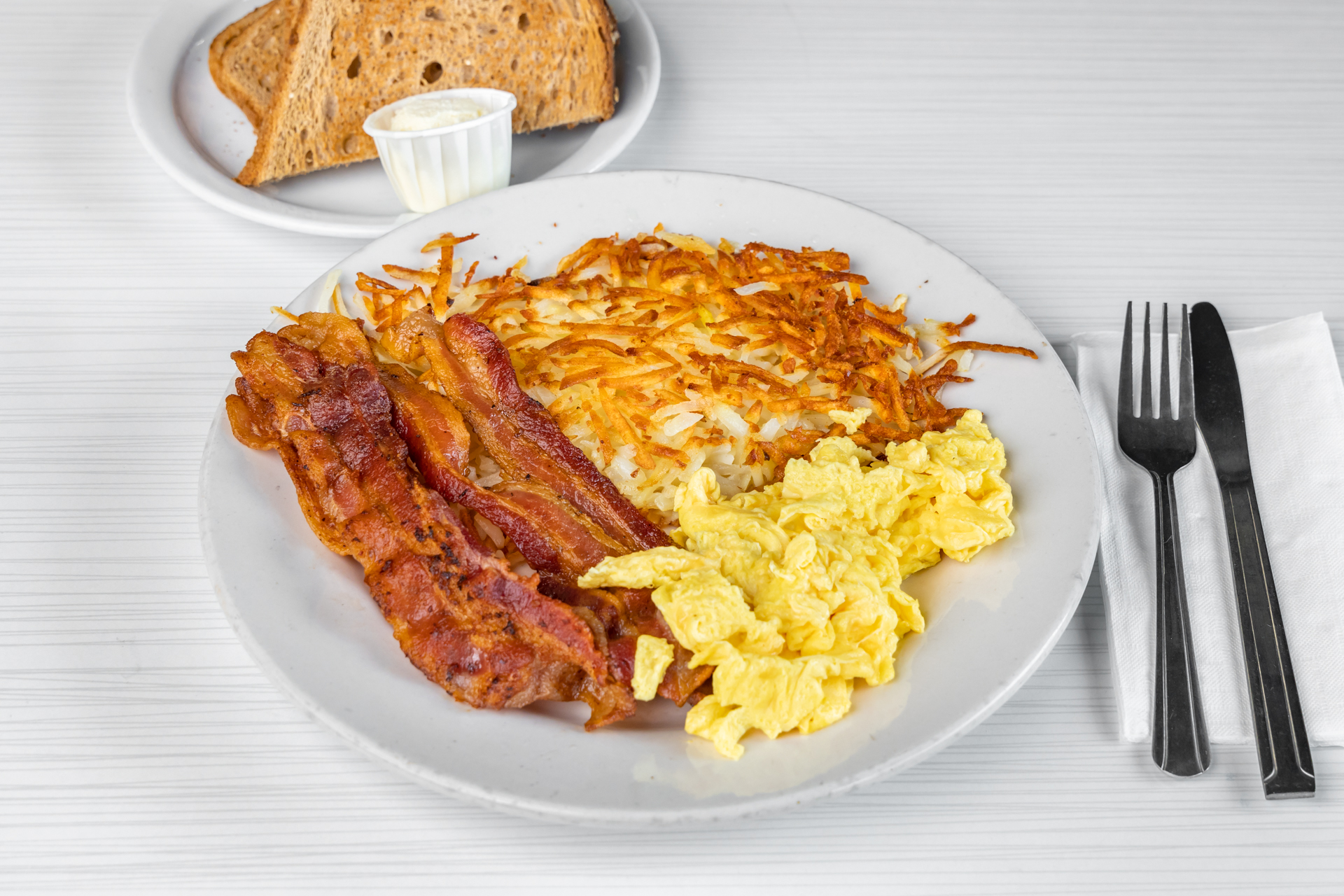 Order 3. Four Piece Bacon and 3 Eggs Breakfast food online from Goody Cafe store, Palm Desert on bringmethat.com