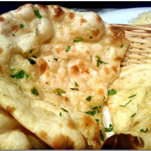Order Garlic Naan food online from Agra Cafe store, Los Angeles on bringmethat.com
