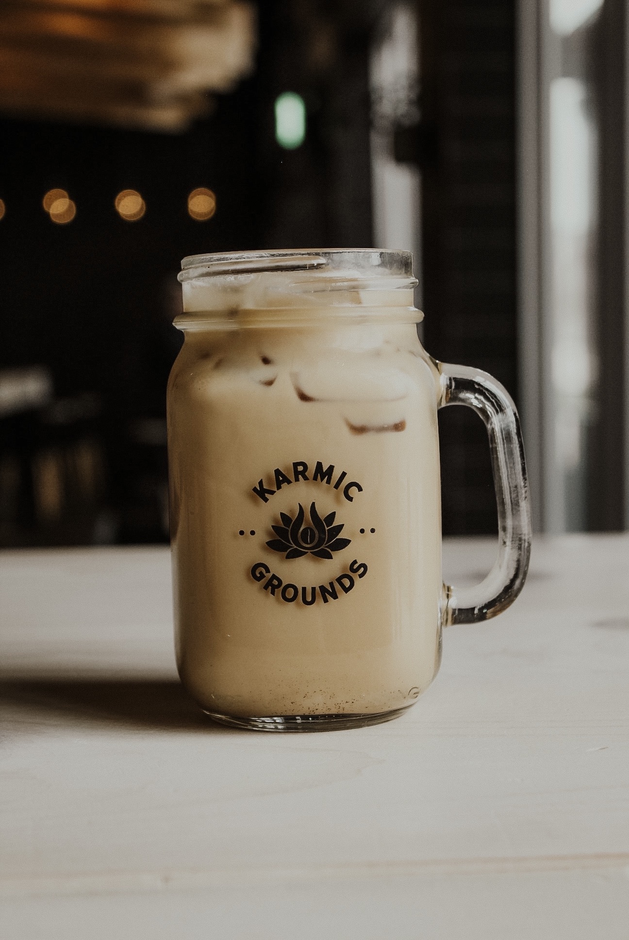 Order Iced Latte food online from Karmic Grounds store, Frisco on bringmethat.com