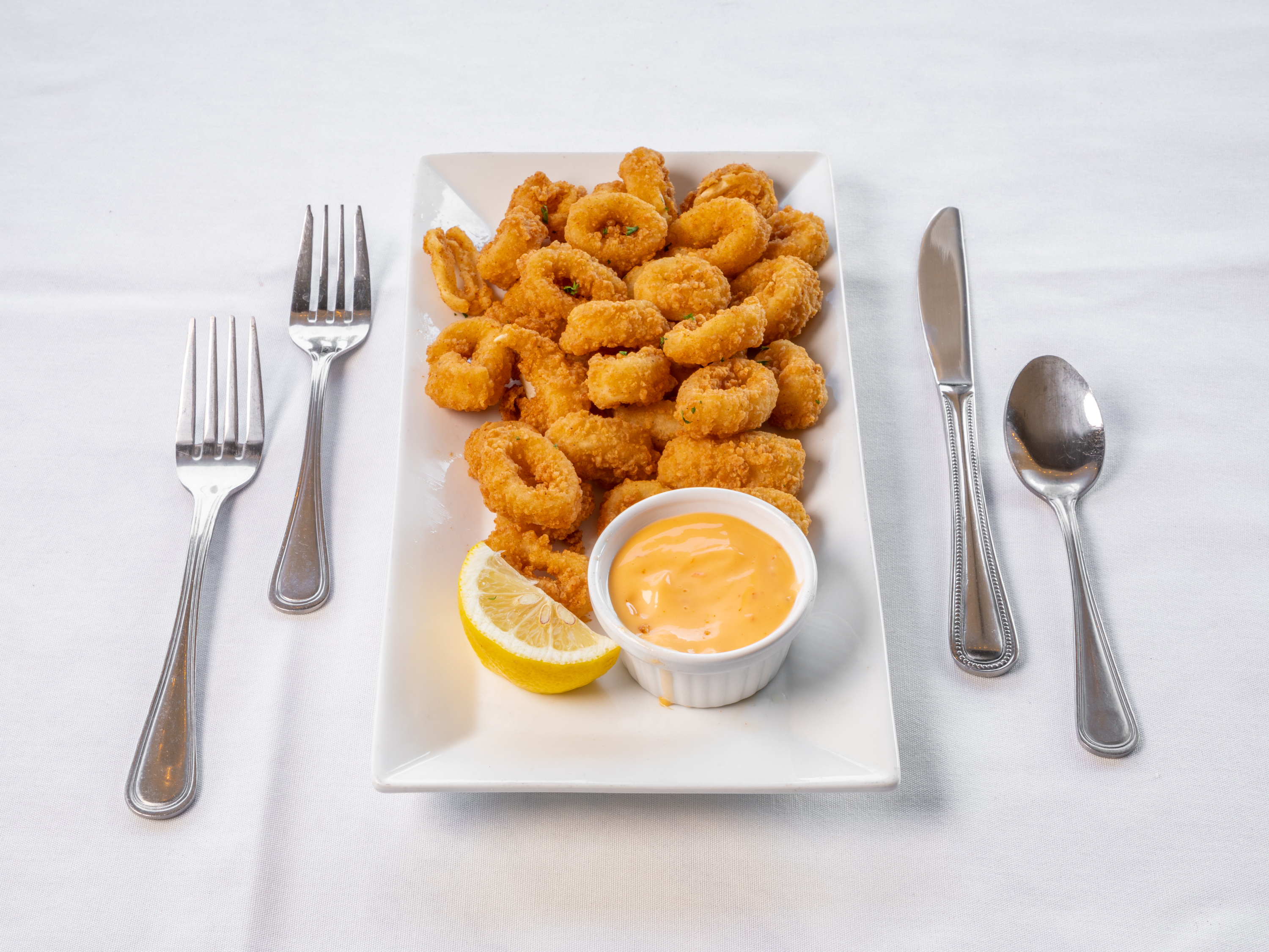 Order Calamari food online from Famous Steakhouse store, Tulsa on bringmethat.com