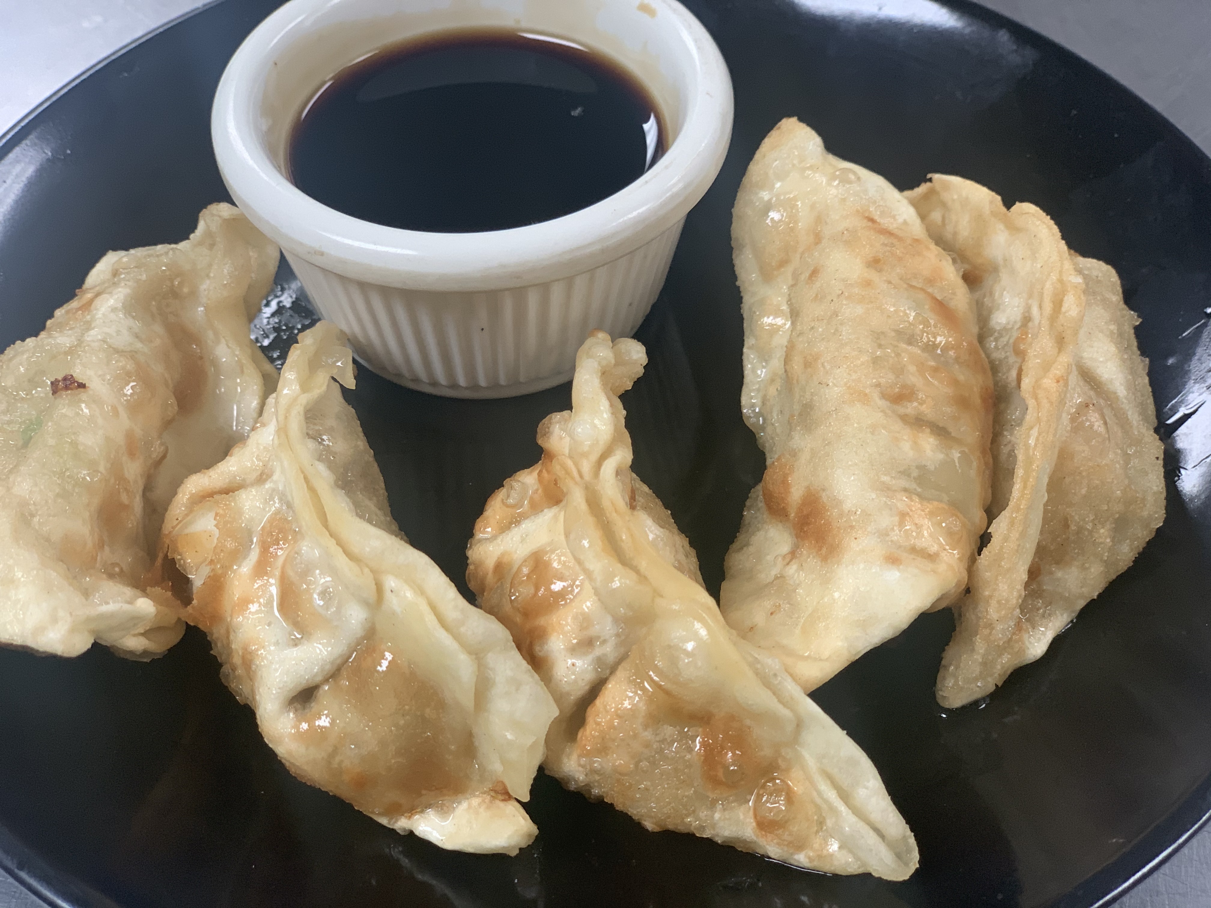 Order A-6. Chicken Crispy Potstickers food online from 5 R CHA Thai Bistro store, Mesa on bringmethat.com