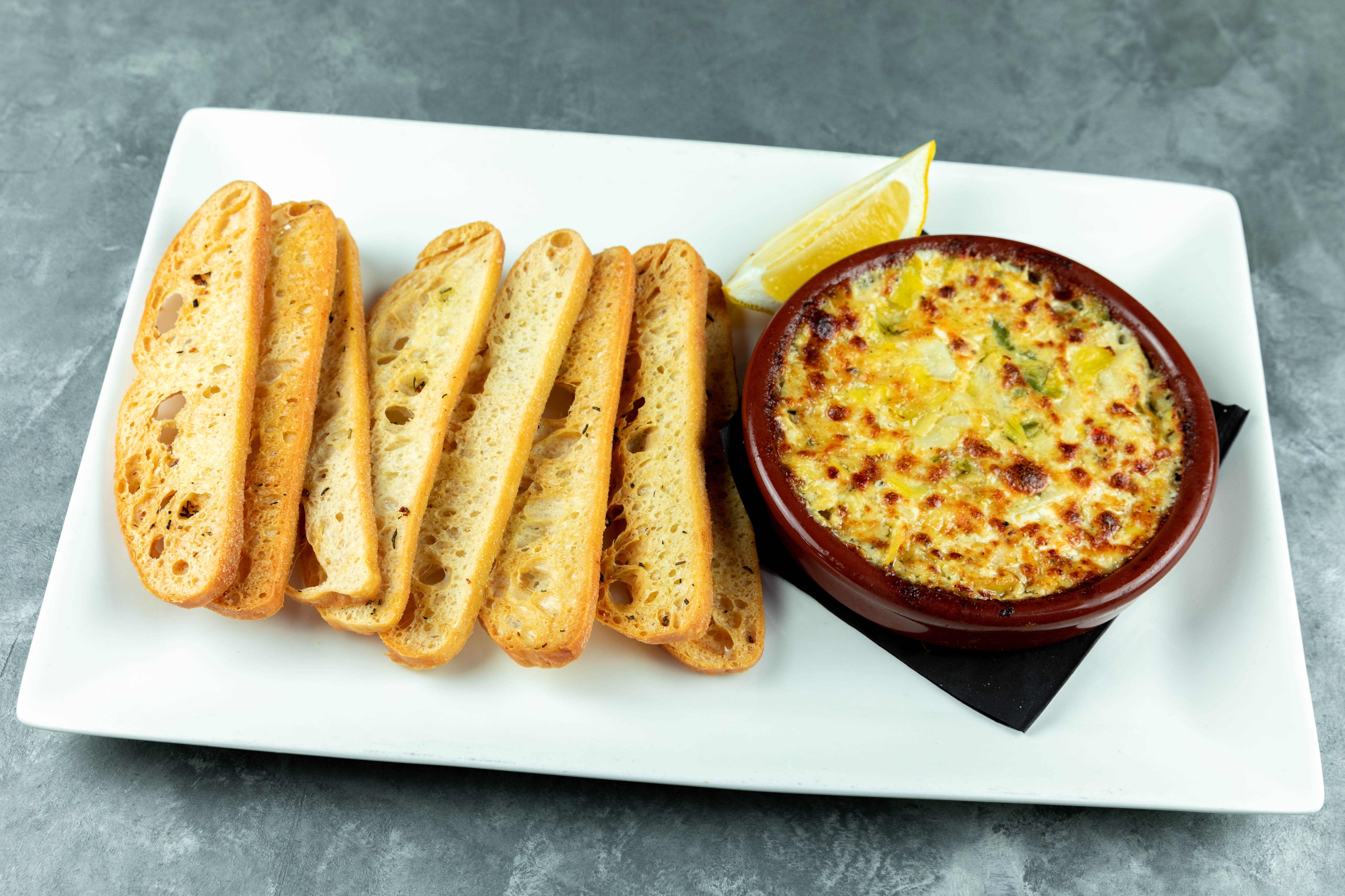 Order Famous Spicy Artichoke Dip food online from Patxi Pizza store, Livermore on bringmethat.com