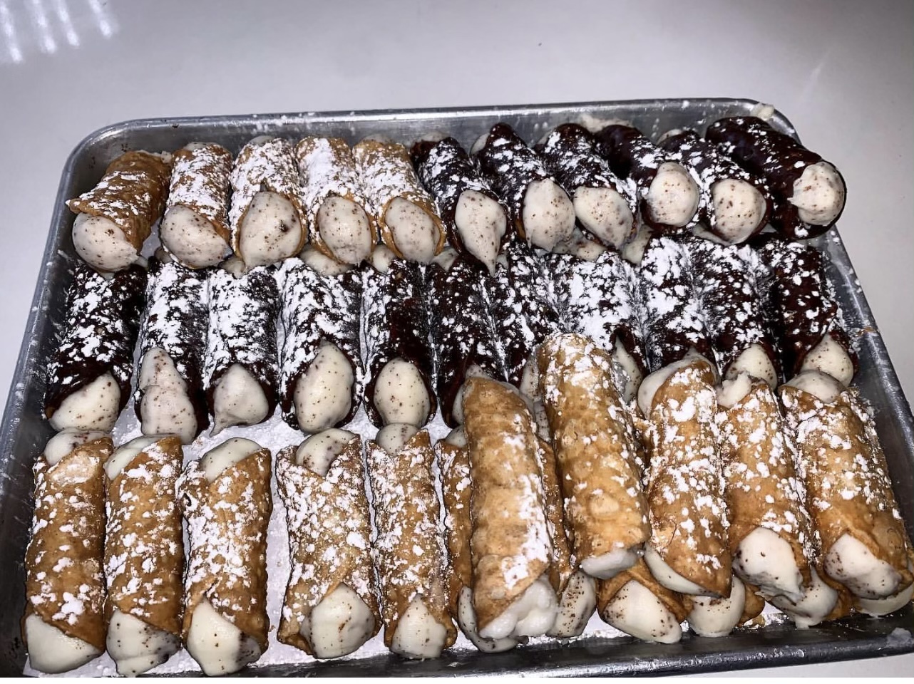 Order Home Made Mini Cannoli  food online from Famous Calabria store, New York on bringmethat.com