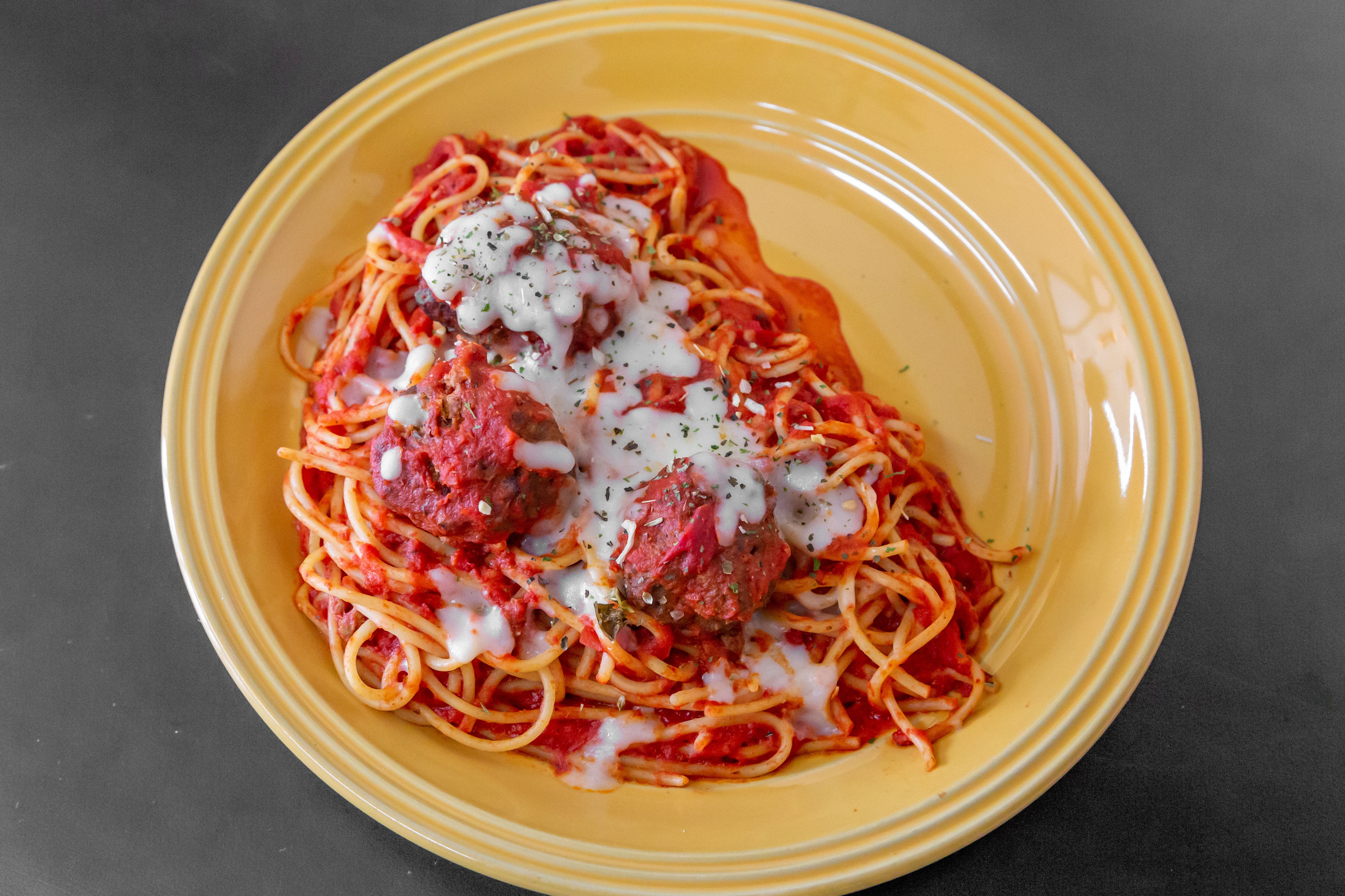 Order Spaghetti with Meatballs - Pasta food online from New York Pizzeria & Catering store, Dobson on bringmethat.com