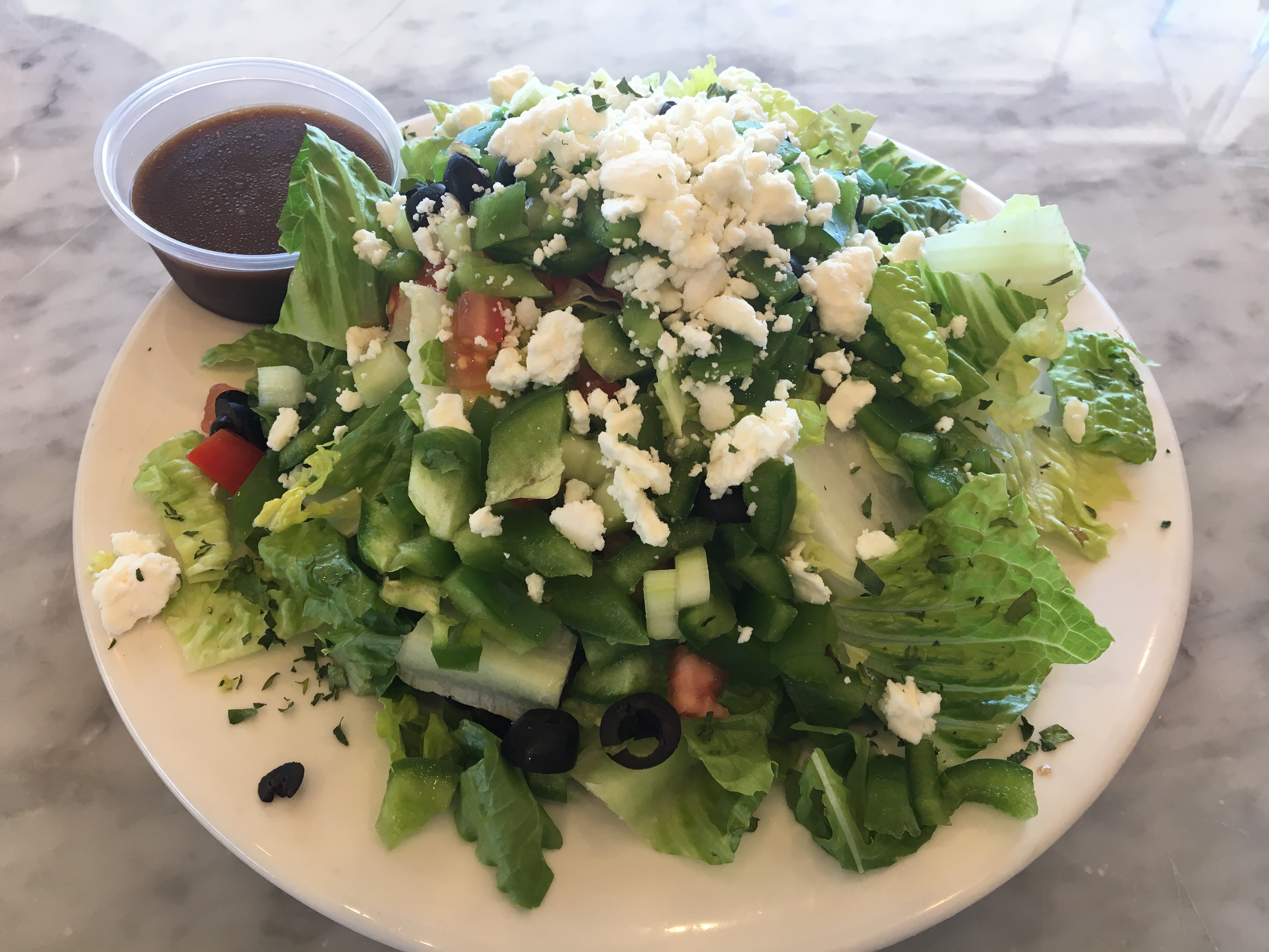 Order Greek Salad food online from Tonino's Place Pizzeria store, Woodland Hills on bringmethat.com