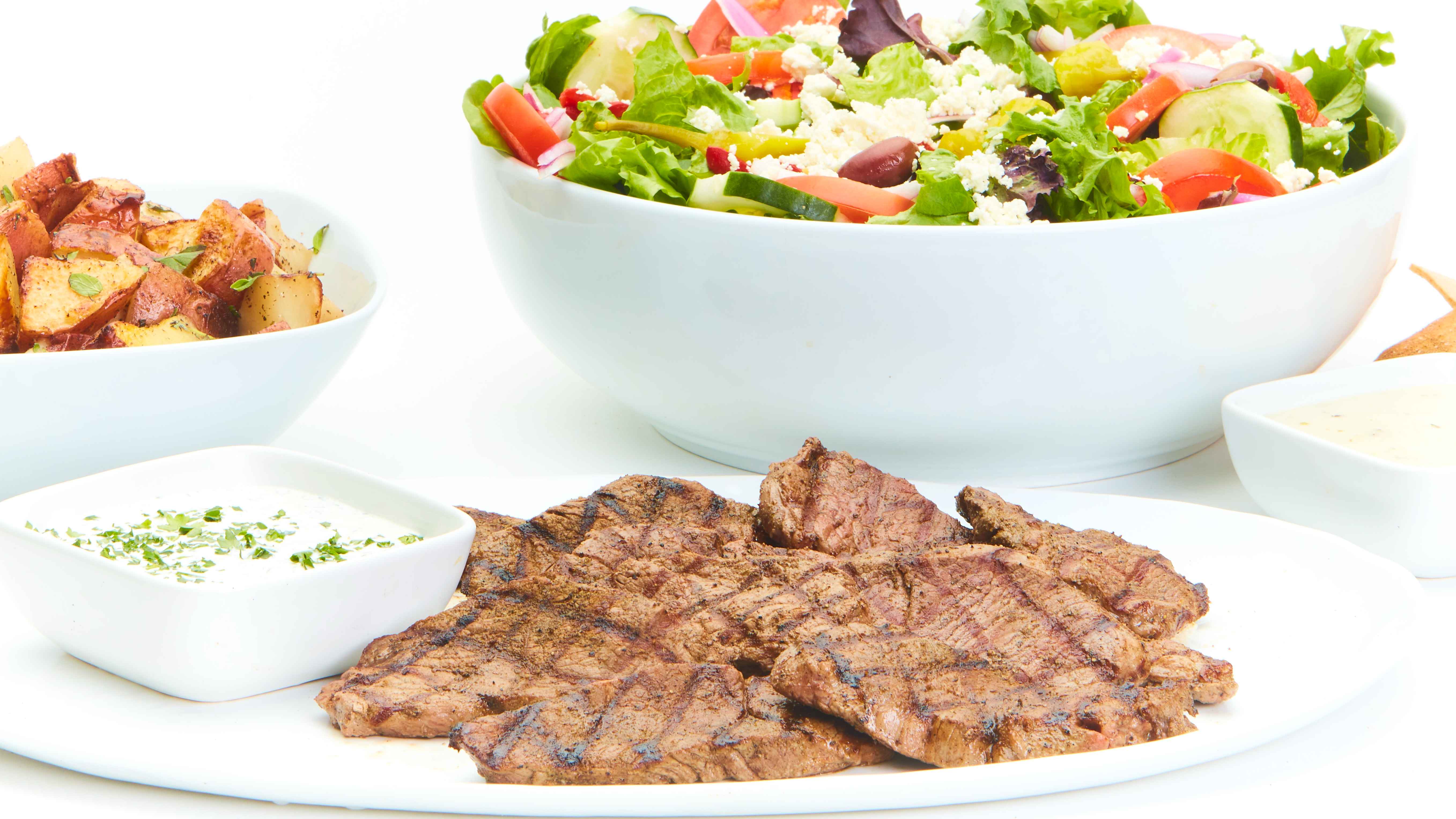 Order Grilled Lamb Feast for 4 food online from Taziki's Mediterranean Cafe store, Charlotte on bringmethat.com