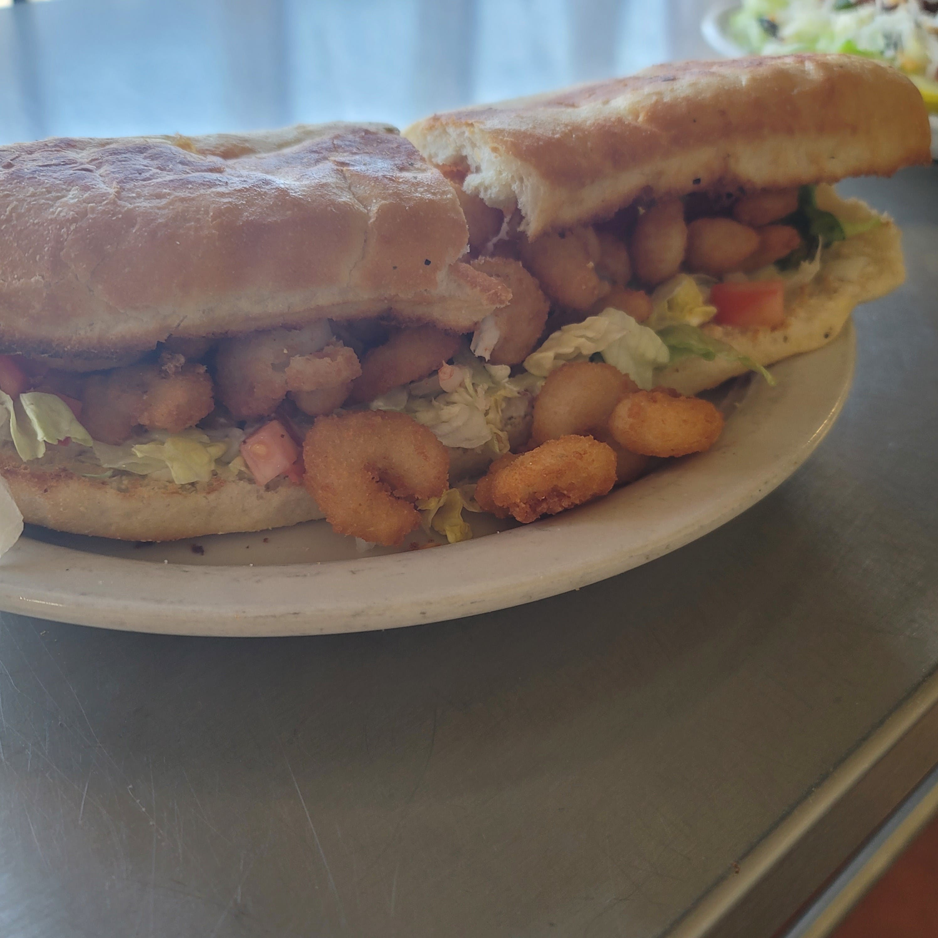 Order Seafood Po Boy Sandwich - Half food online from The Pizza Den store, Hoxie on bringmethat.com
