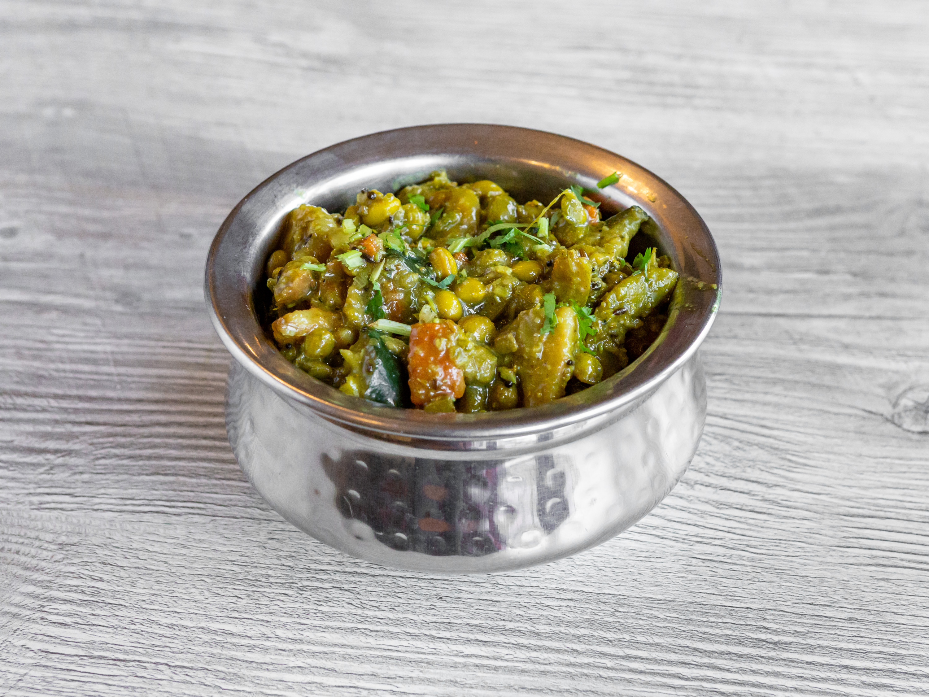 Order Vegetarian Undhiyu food online from Indian Village Restaurant store, Greenfield on bringmethat.com