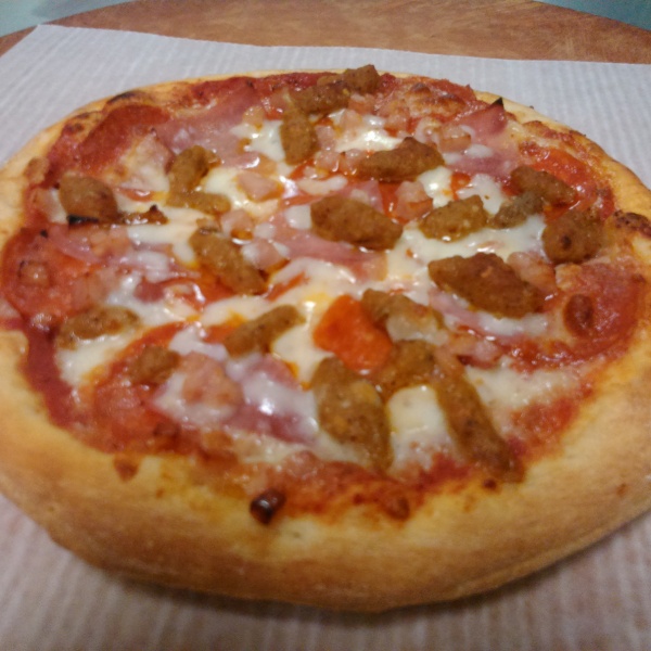 Order Meat Lover Pizza food online from The Champion Pizza store, Houston on bringmethat.com