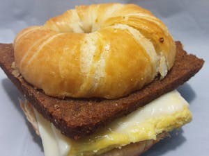 Order SCRAPPLE EGG AND CHEESE ON CROISSANT food online from Millers Country Kitchen store, Middletown on bringmethat.com
