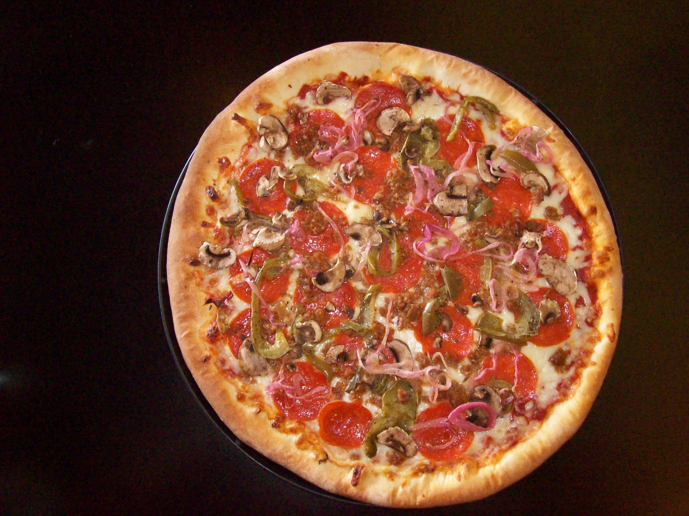 Order House Special Pizza food online from Craigo's Pizza & Pastaria store, Austin on bringmethat.com