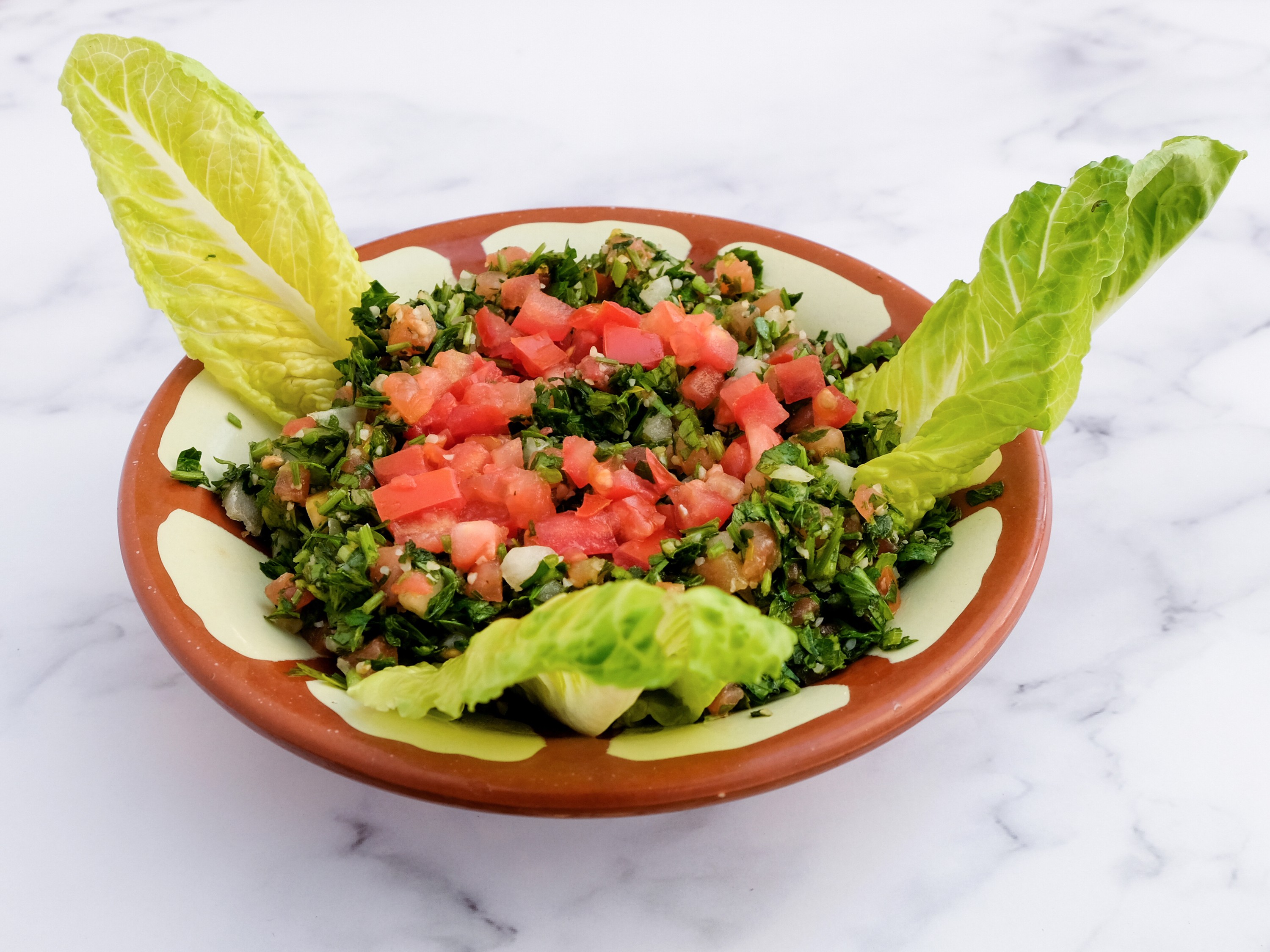 Order Tabbouleh Salad food online from Alwadi Cafe store, Bedford on bringmethat.com