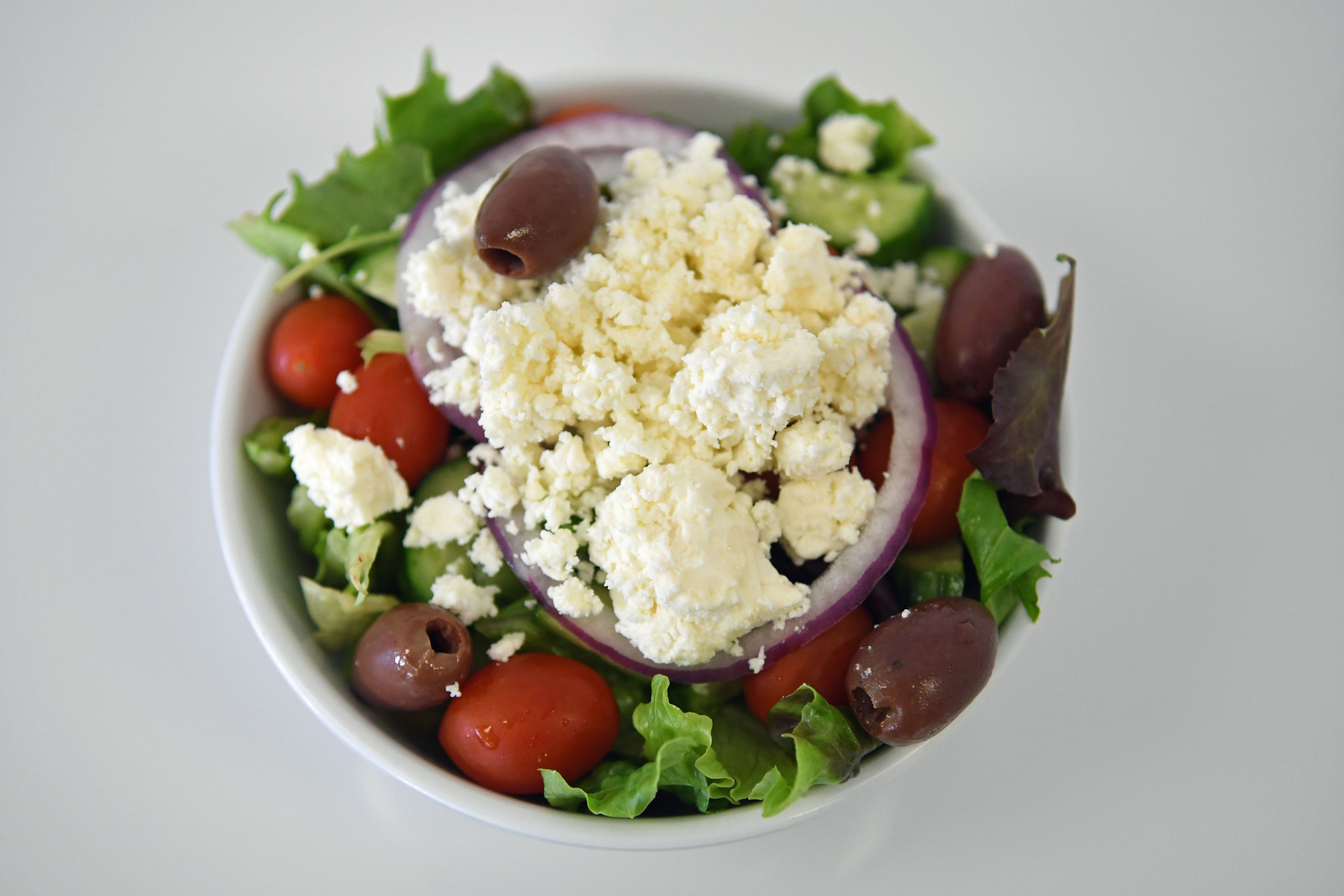 Order Side Greek Salad food online from Your Greek Cousin store, West Palm Beach on bringmethat.com