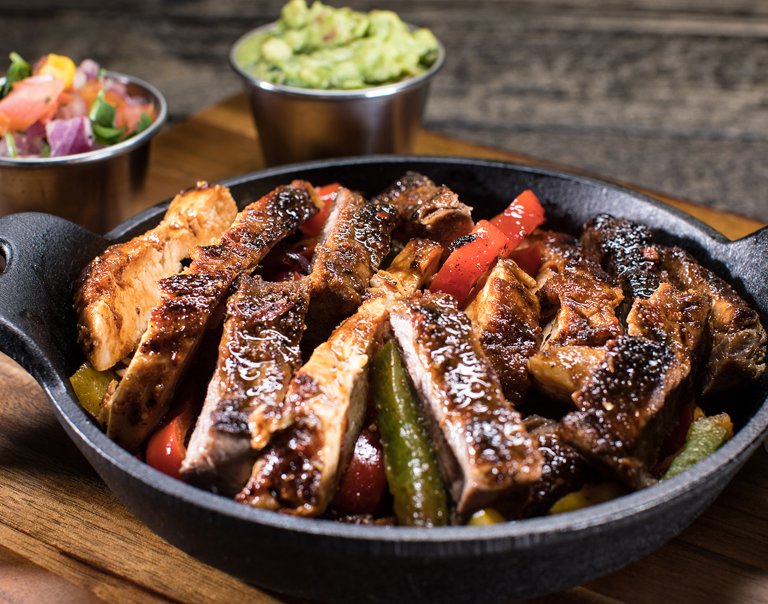 Order Chicken and Carne Asada Steak Fajitas food online from Mixteco Mexican Grill store, Chicago on bringmethat.com